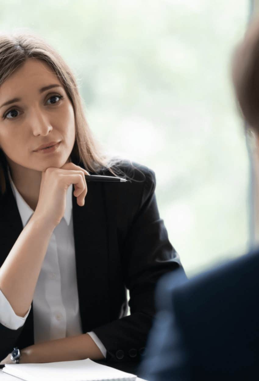 person pausing in conversation