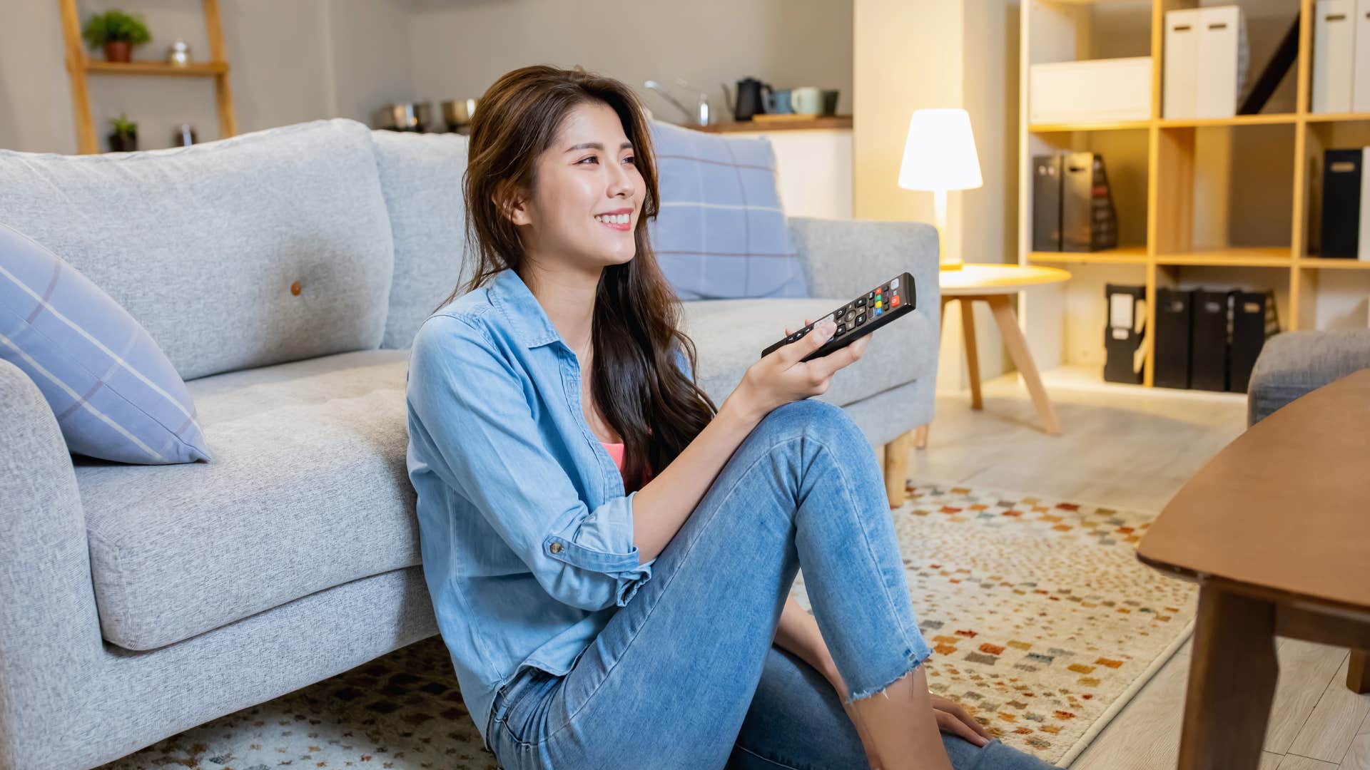 woman who hates going out watching streaming services in her home