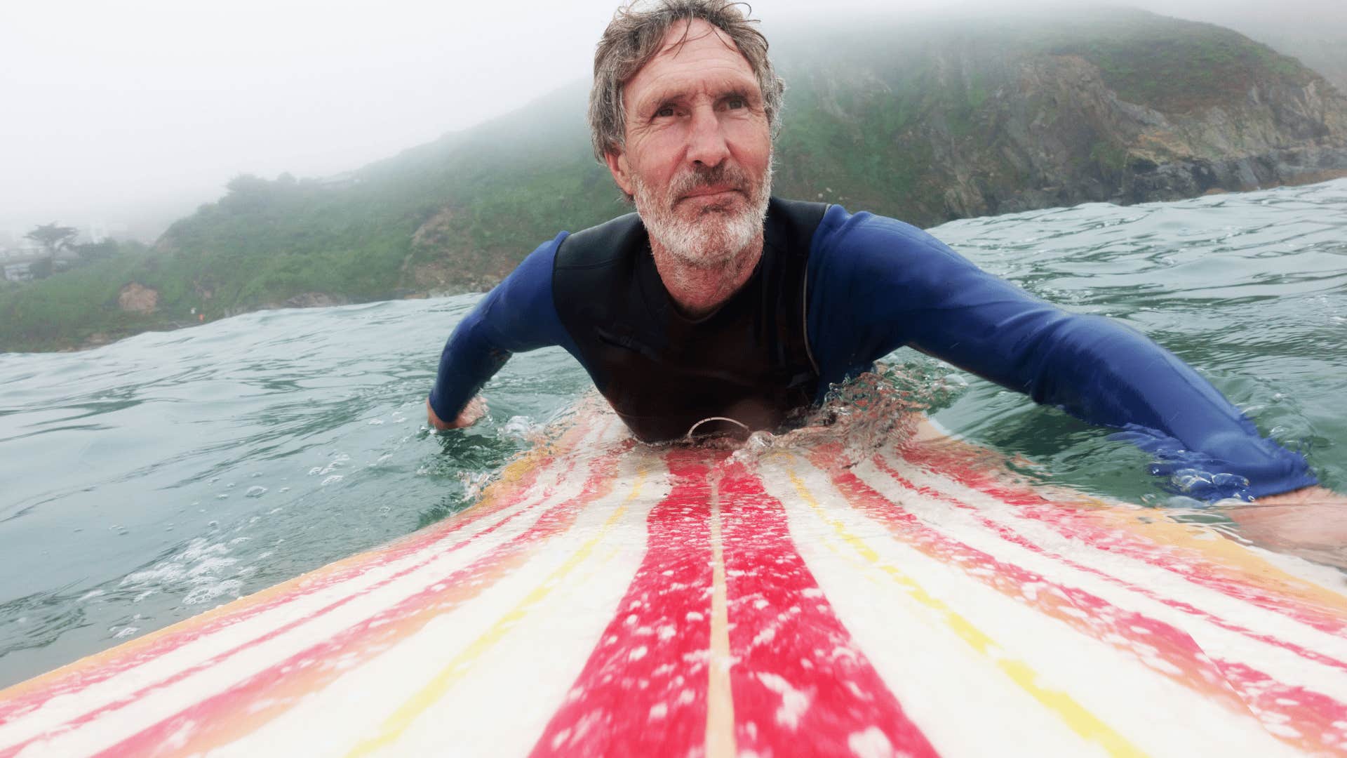 man who doesn't need outside approval like he used to surfing alone