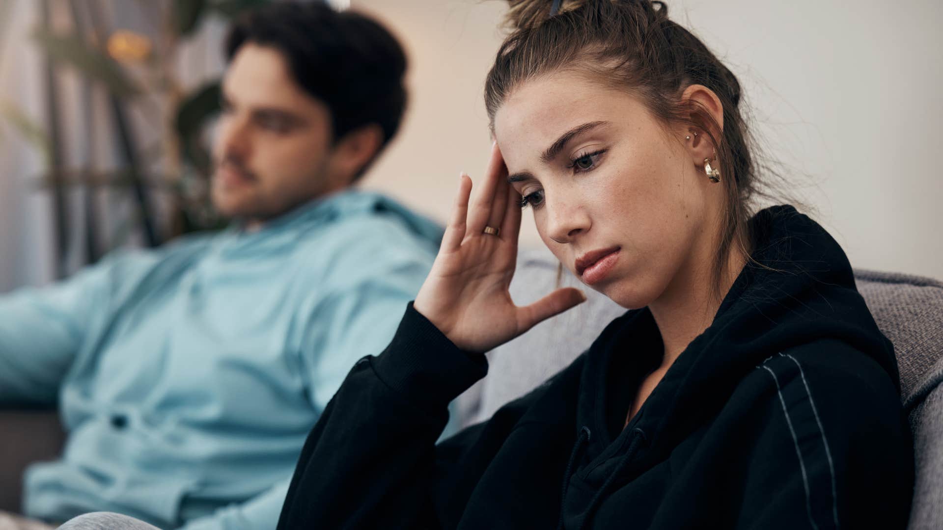 Woman with unrealistic expectations turned away from her partner.