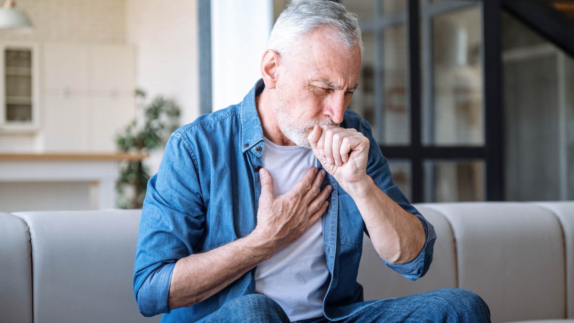 sick man coughing struggling with physical limitations