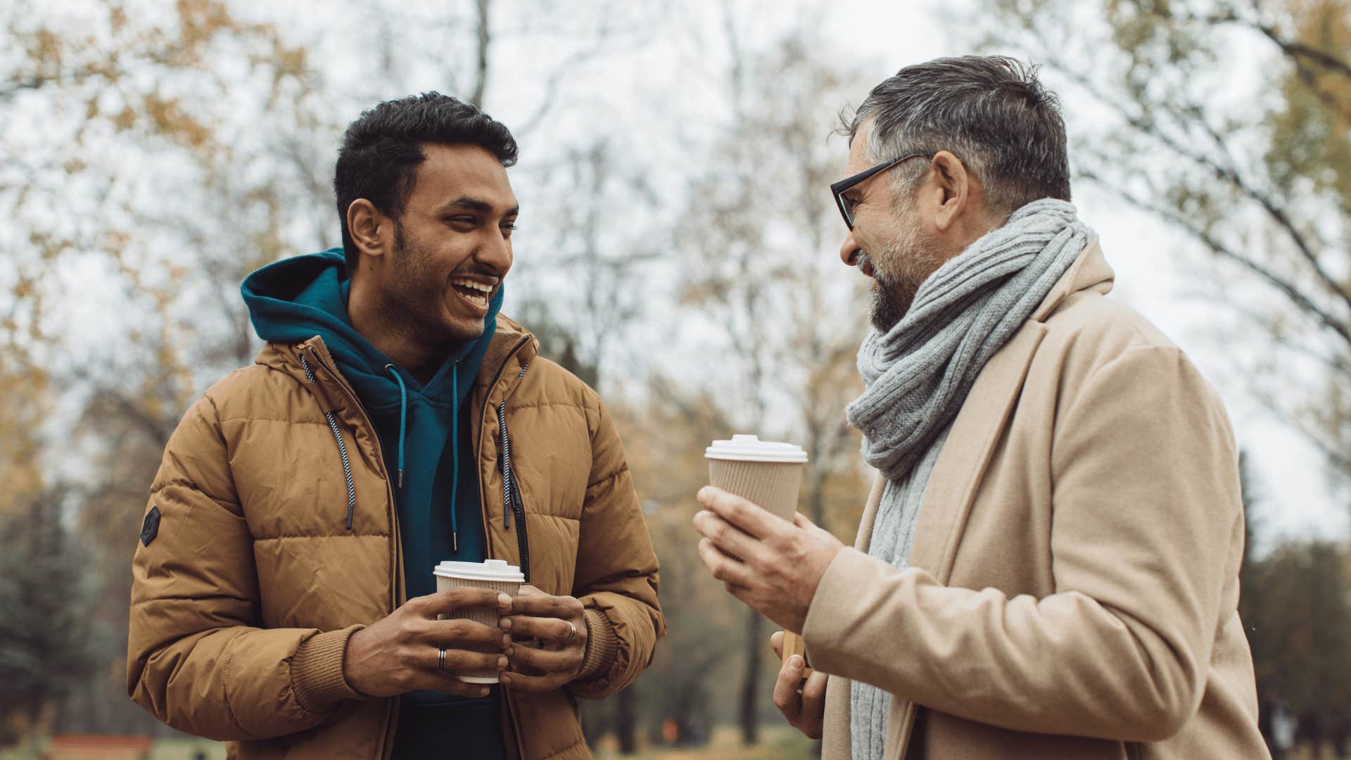 two friends talking and laughing outside