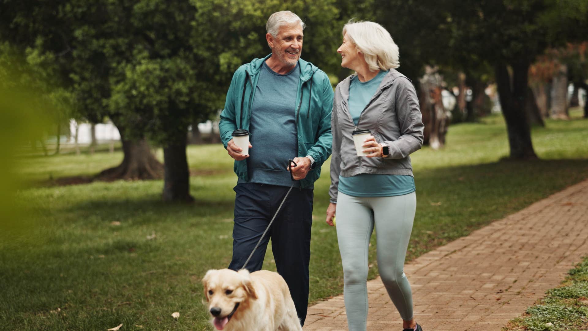 older couple jogging with dog drama free