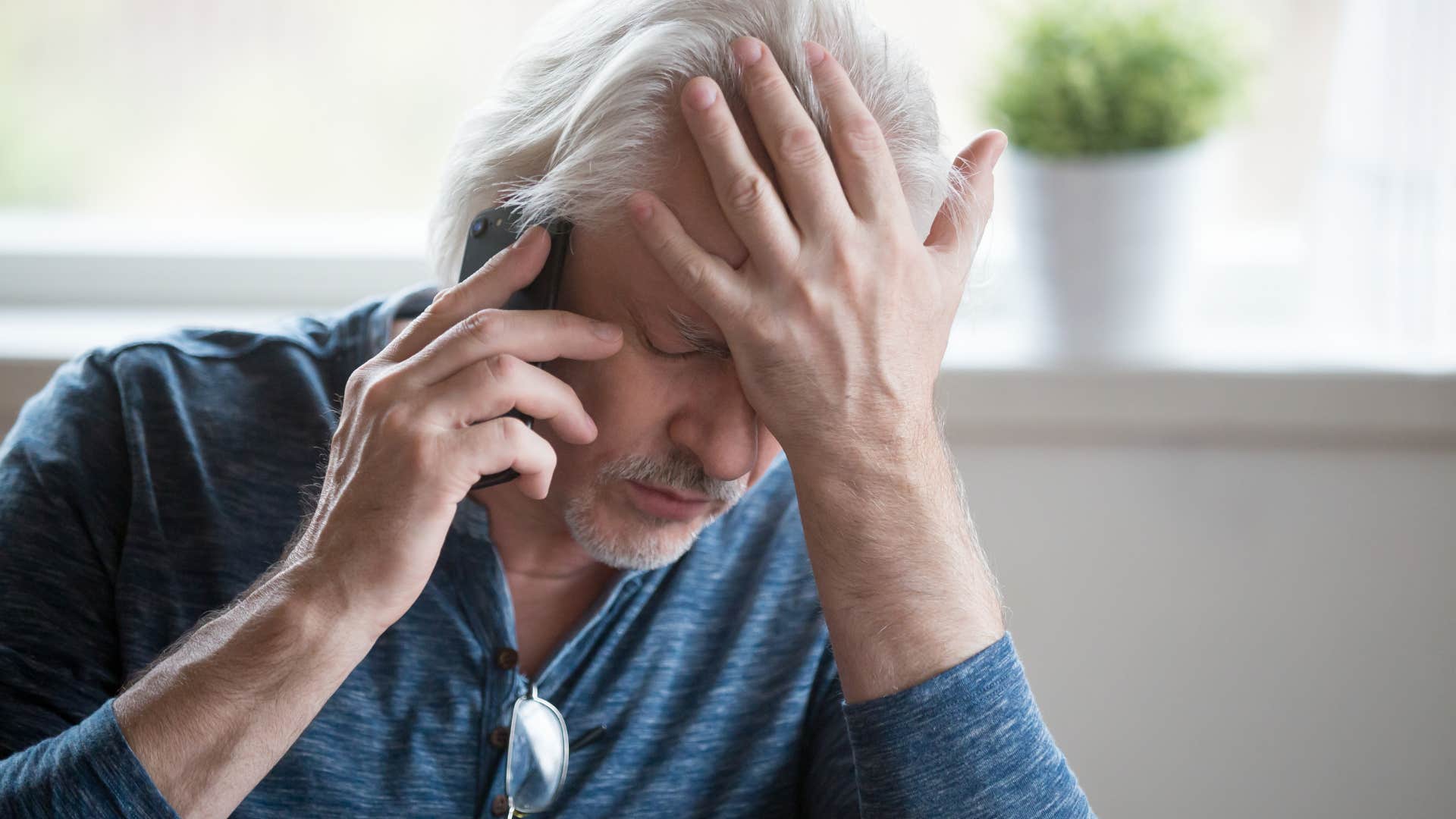 stressed man on the phone running out of time
