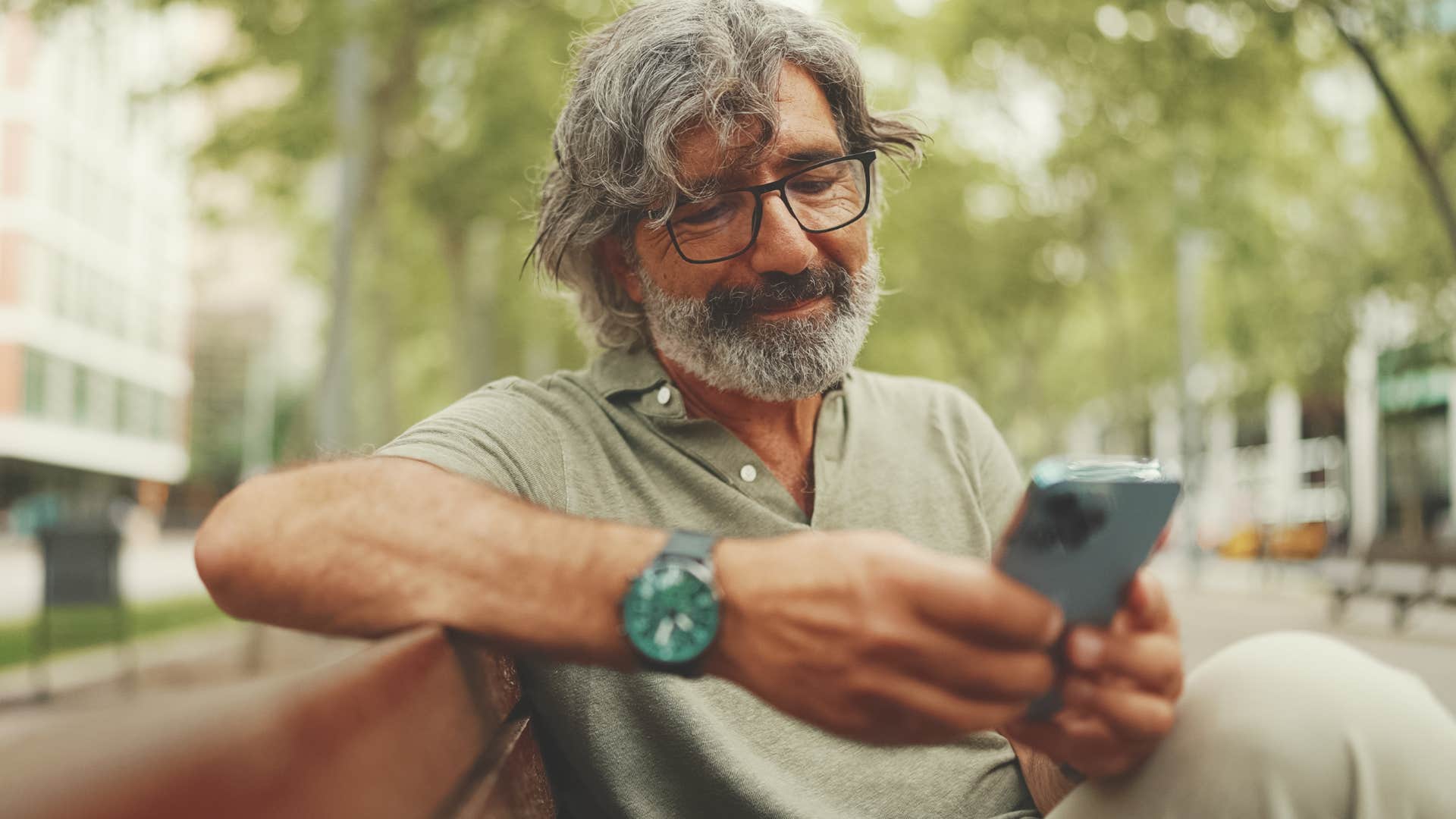 man scrolling on his phone