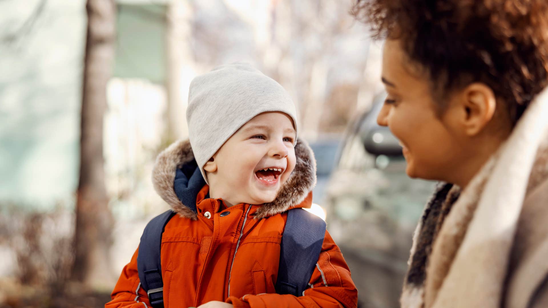 caregiving woman looking after young boy