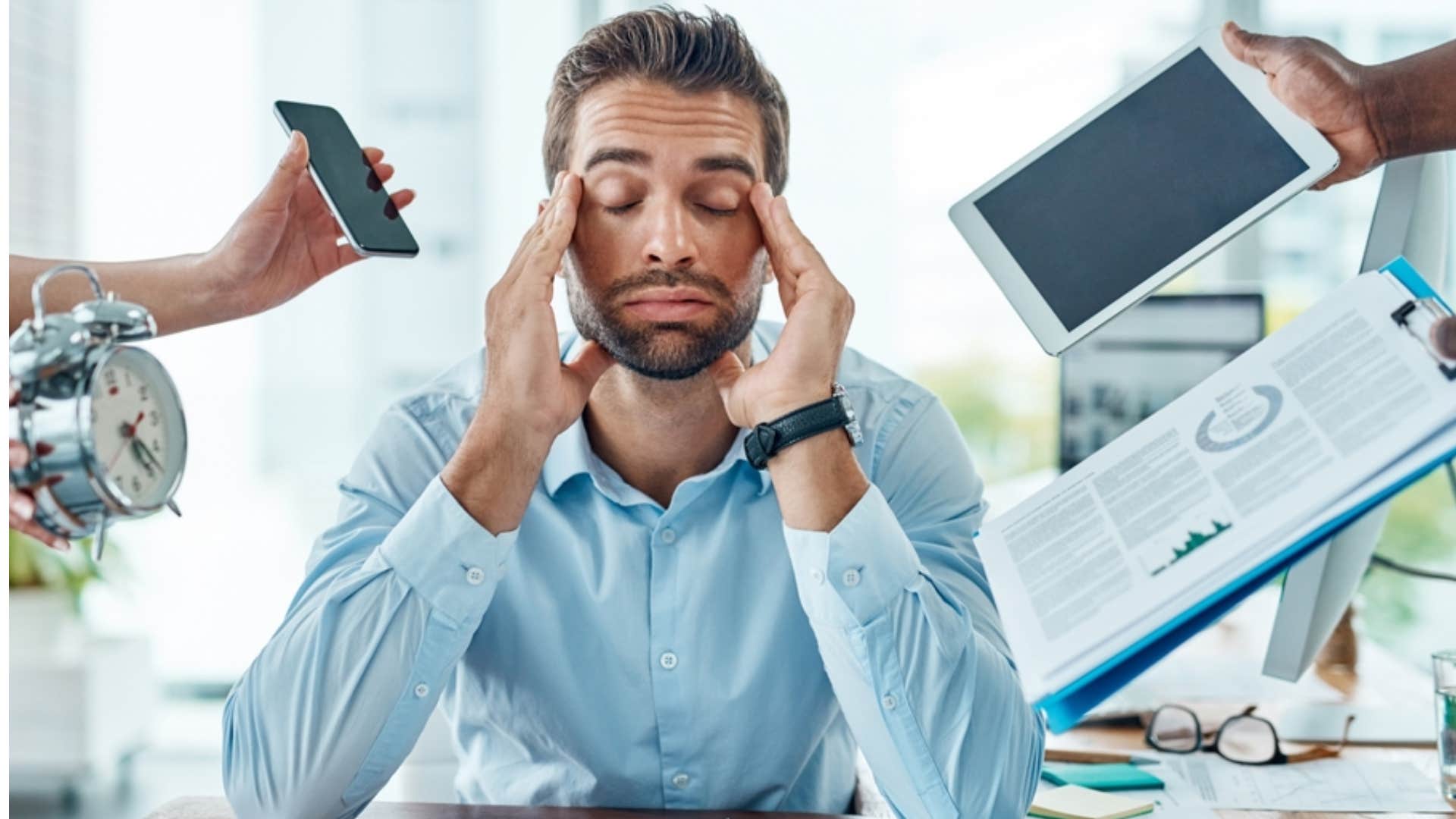 man suffering from decision fatigue feeling overwhelmed