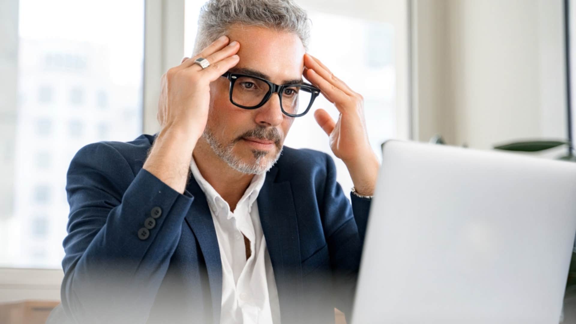 stressed man facing pressure to maintain his persona and image