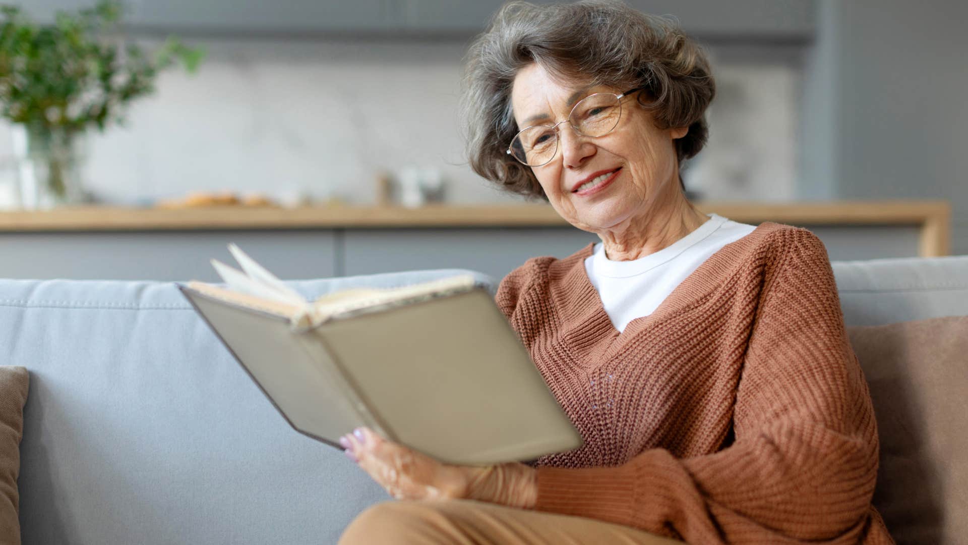 intelligent woman reading a book smiling