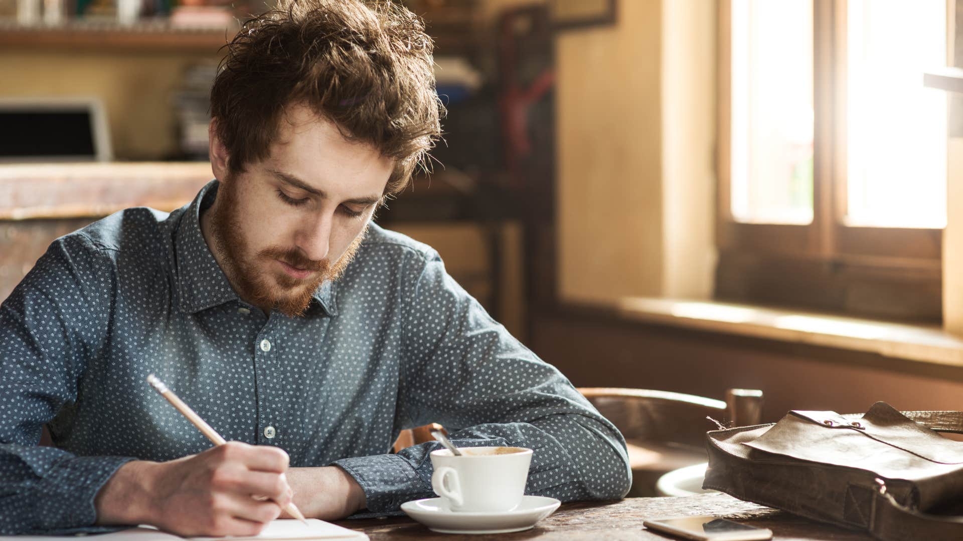 man working on a creative project at home