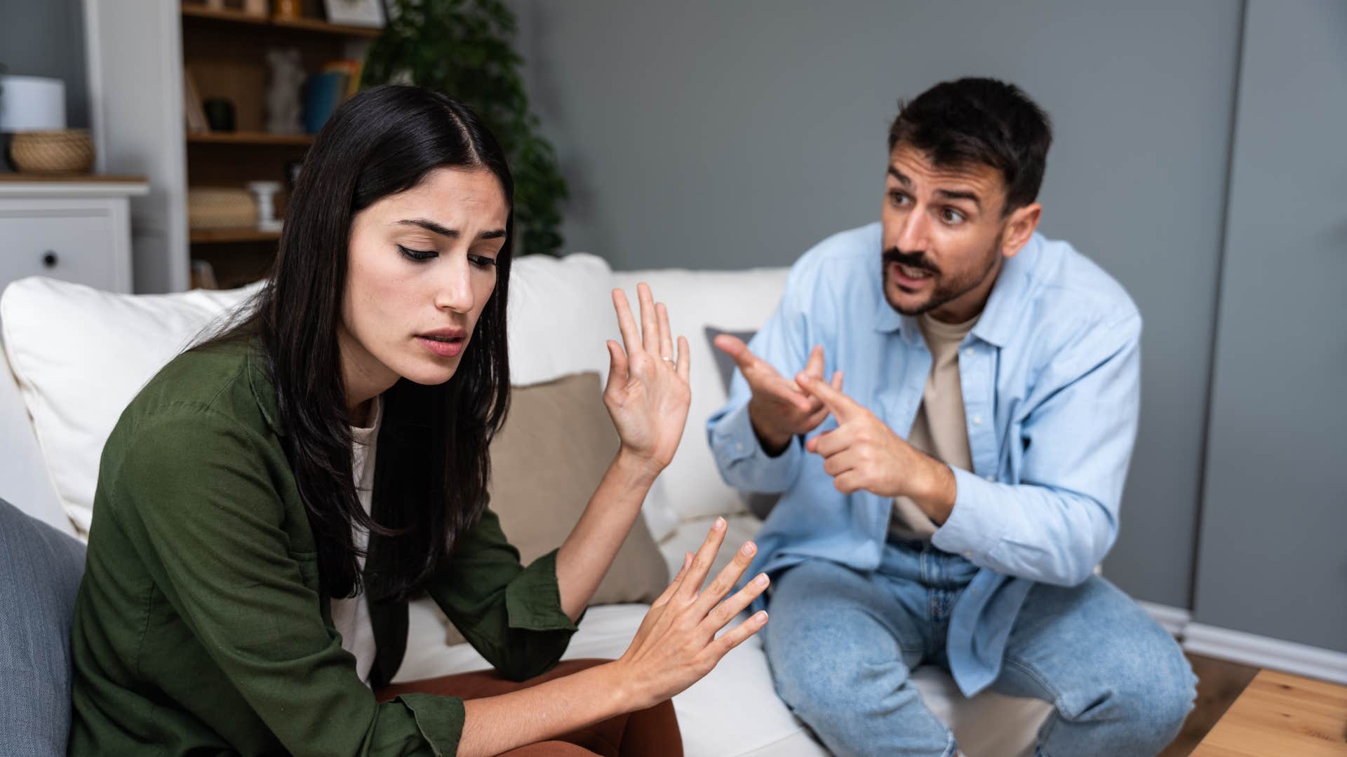 upset woman with personality cues that may mean she's not being fully honest who can't make eye contact