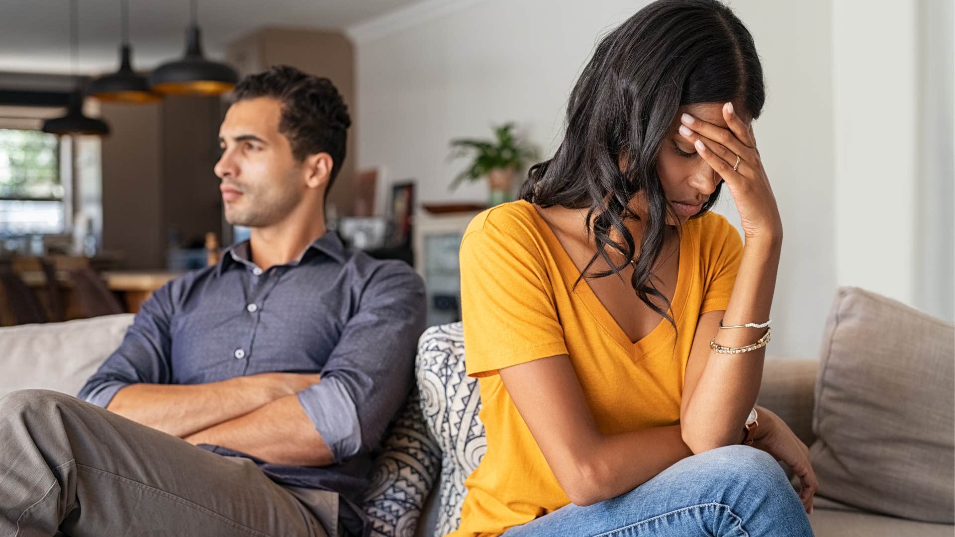 upset woman with personality cues that may mean she's not being fully honest like she blames him