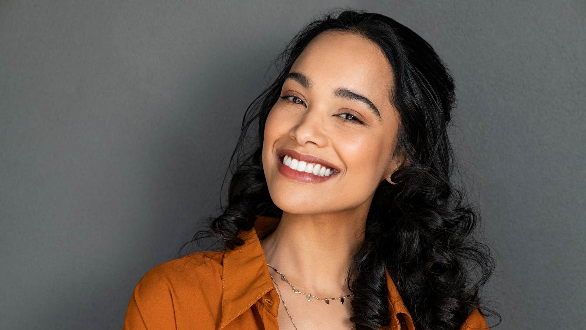 smiling woman with the personality trait charismatic born in march