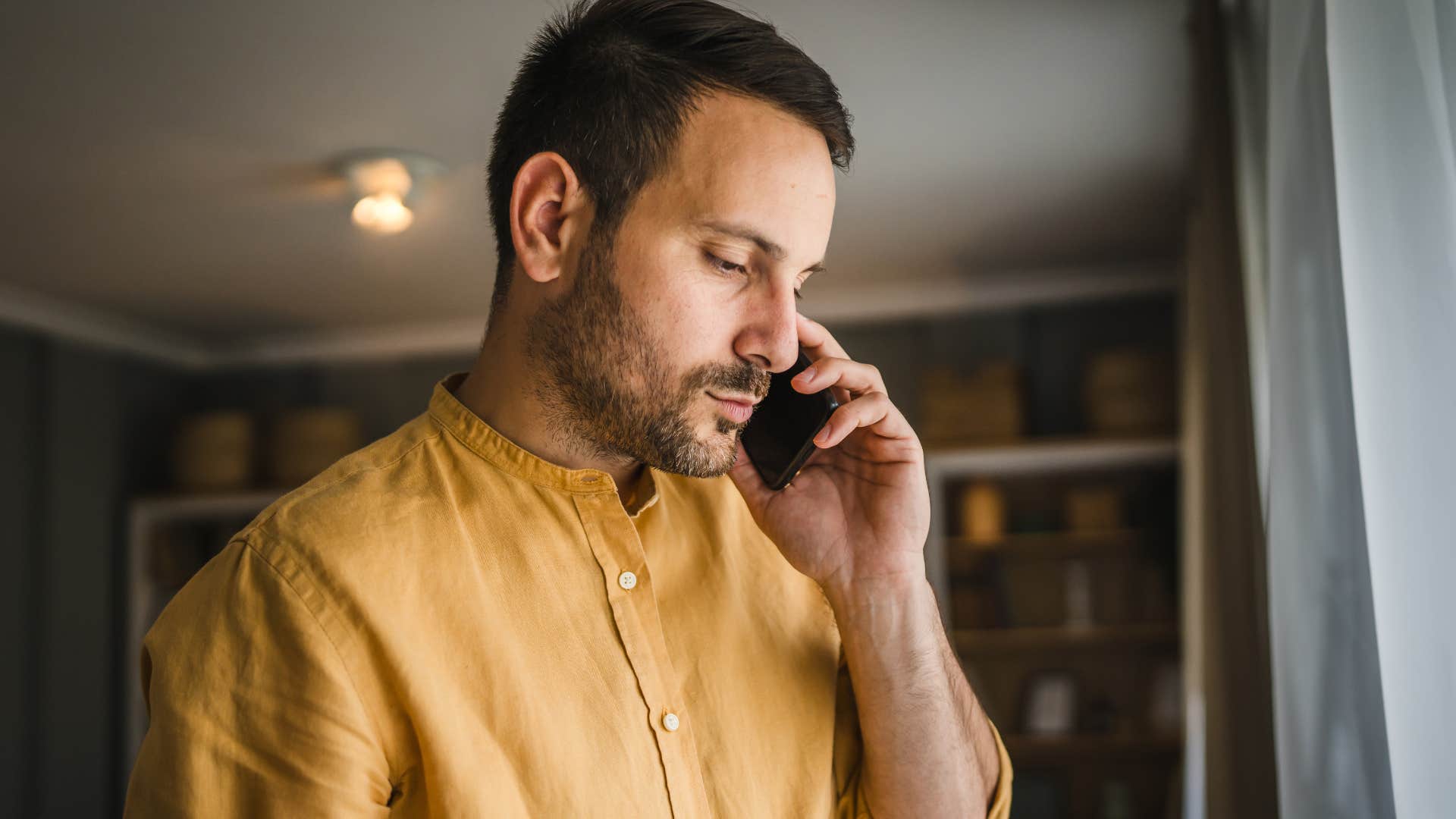 Man saying he's not really feeling up to it on the phone