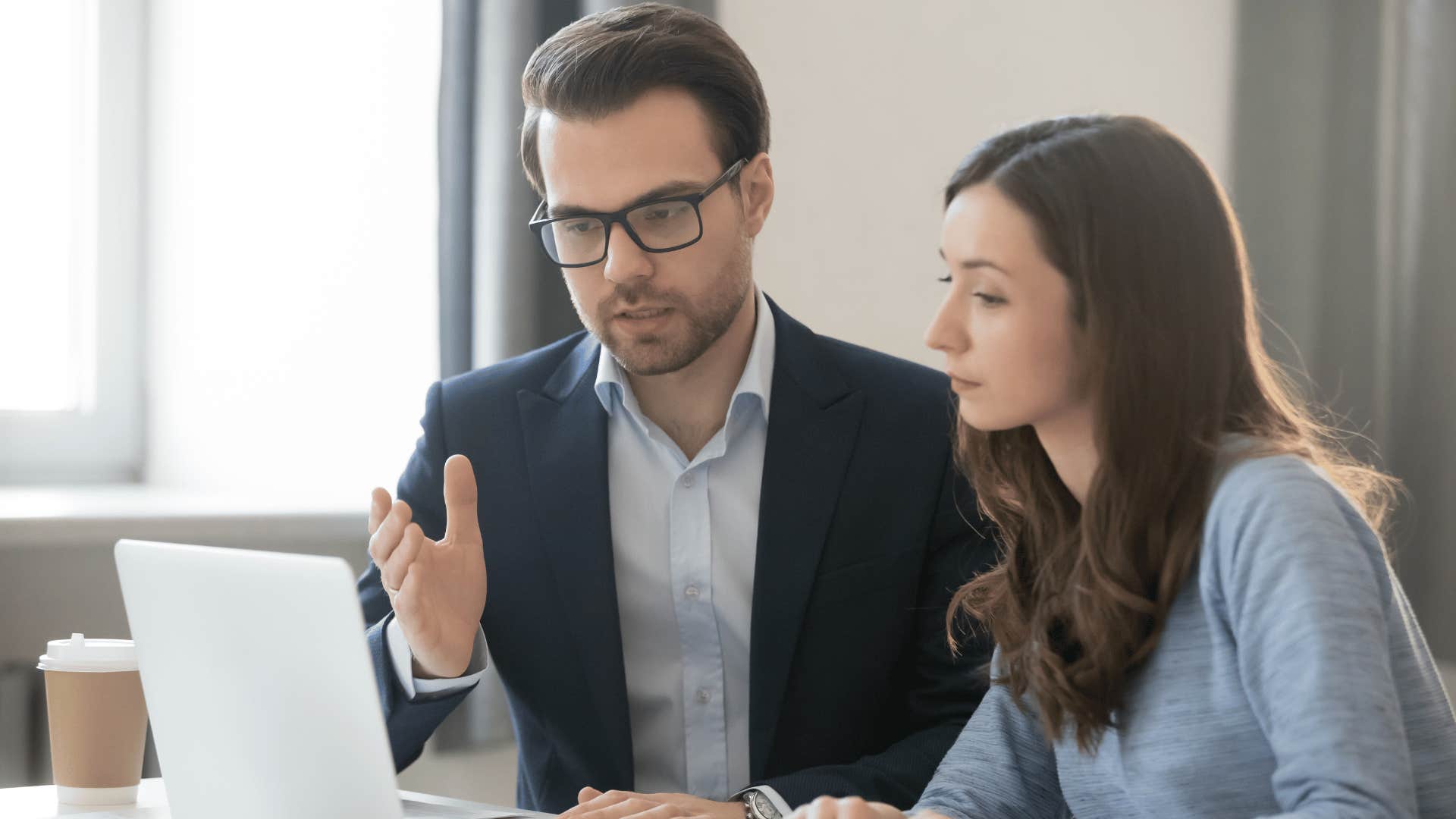 man asking co-worker to send email to not waste time