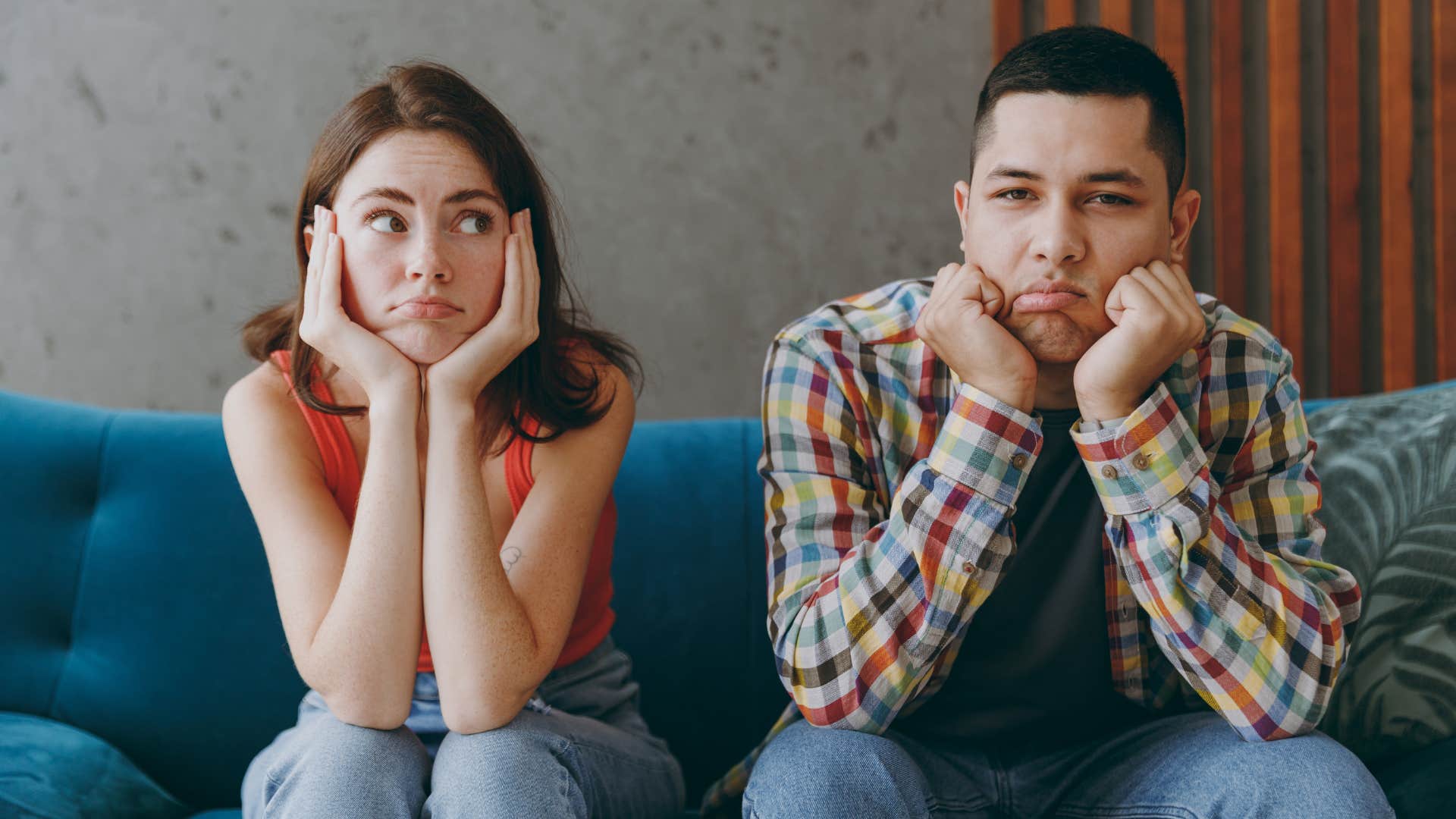 annoyed couple trying to work together after argument
