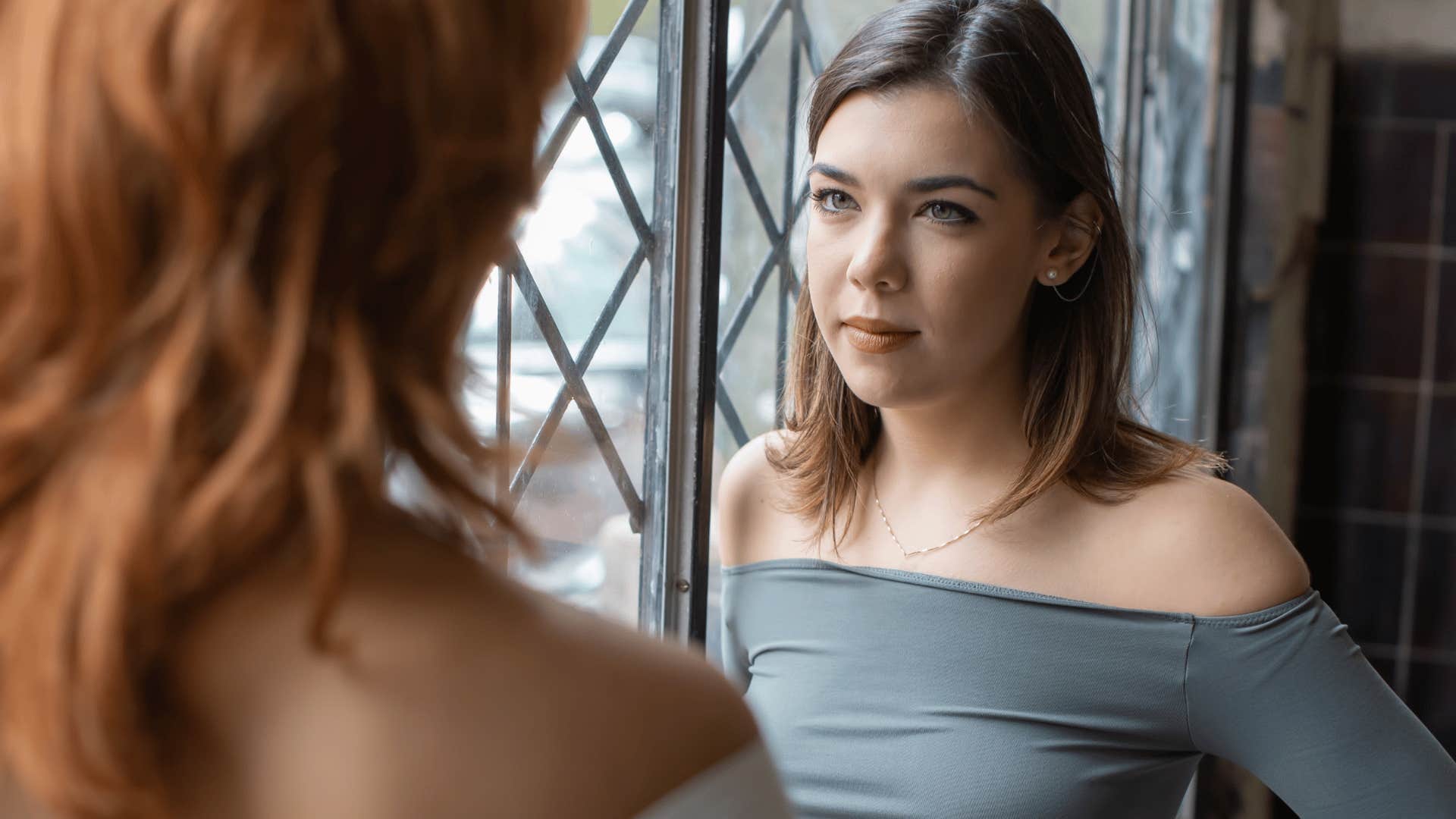 woman not listening to friend talk about her struggles
