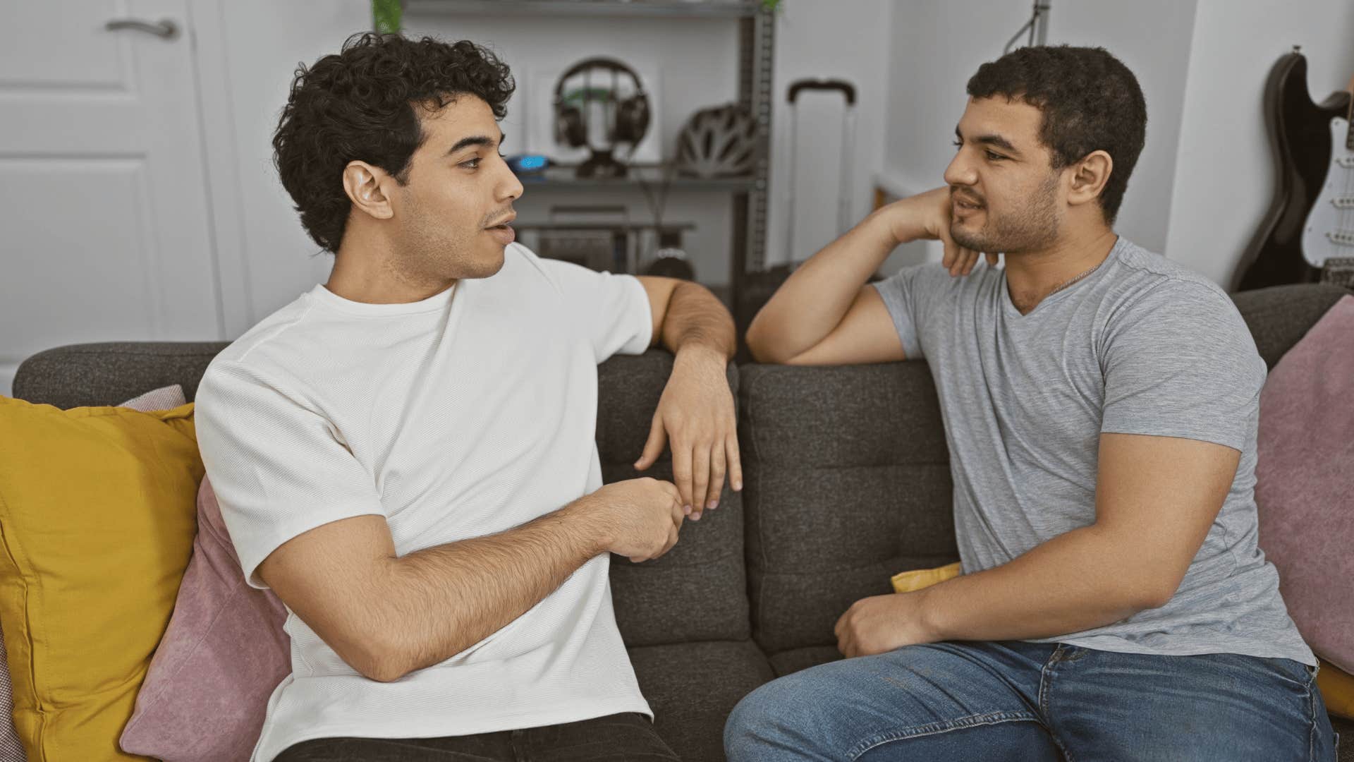 man pretending to care telling his friend it makes sense he feels that way