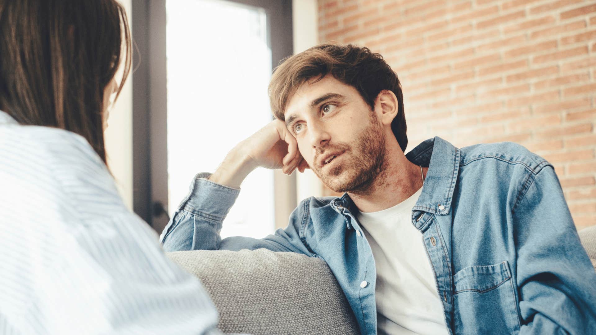 uninterested man telling friend he understands