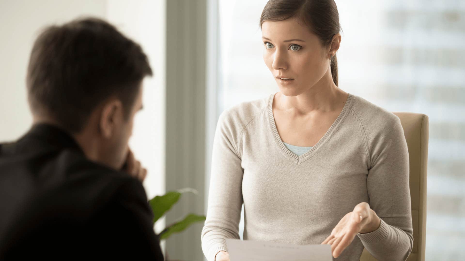woman discussing her job description with boss