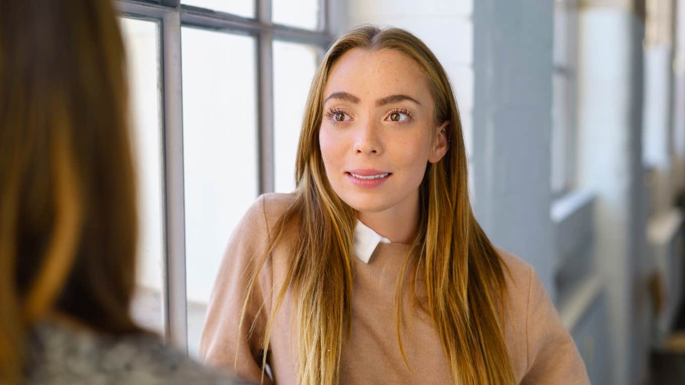 Phrases Brilliant People Use To Say I Told You So Without Being Rude woman talking to colleague about to say i told you so