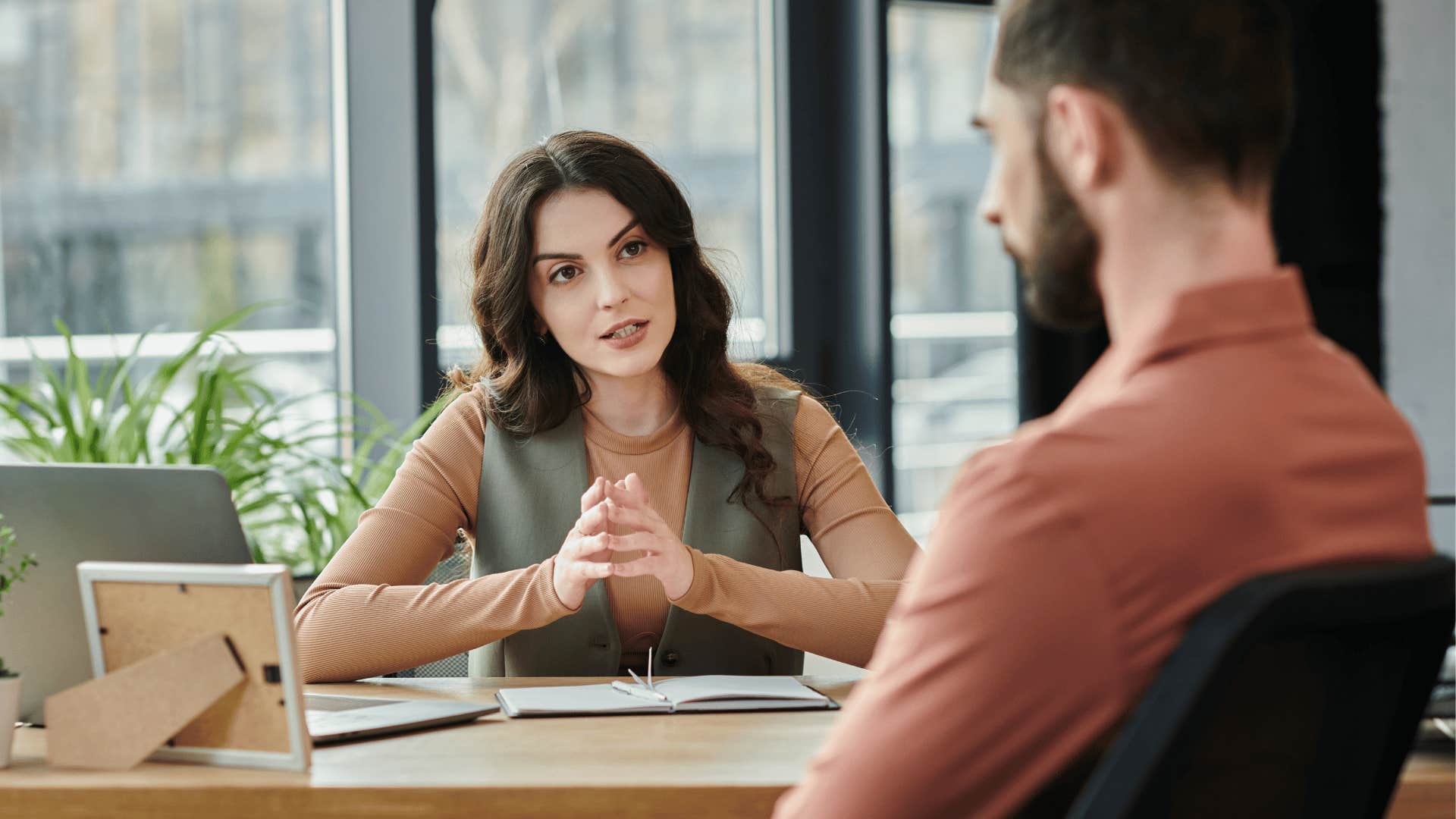serious woman trying to understand co-worker's thinking