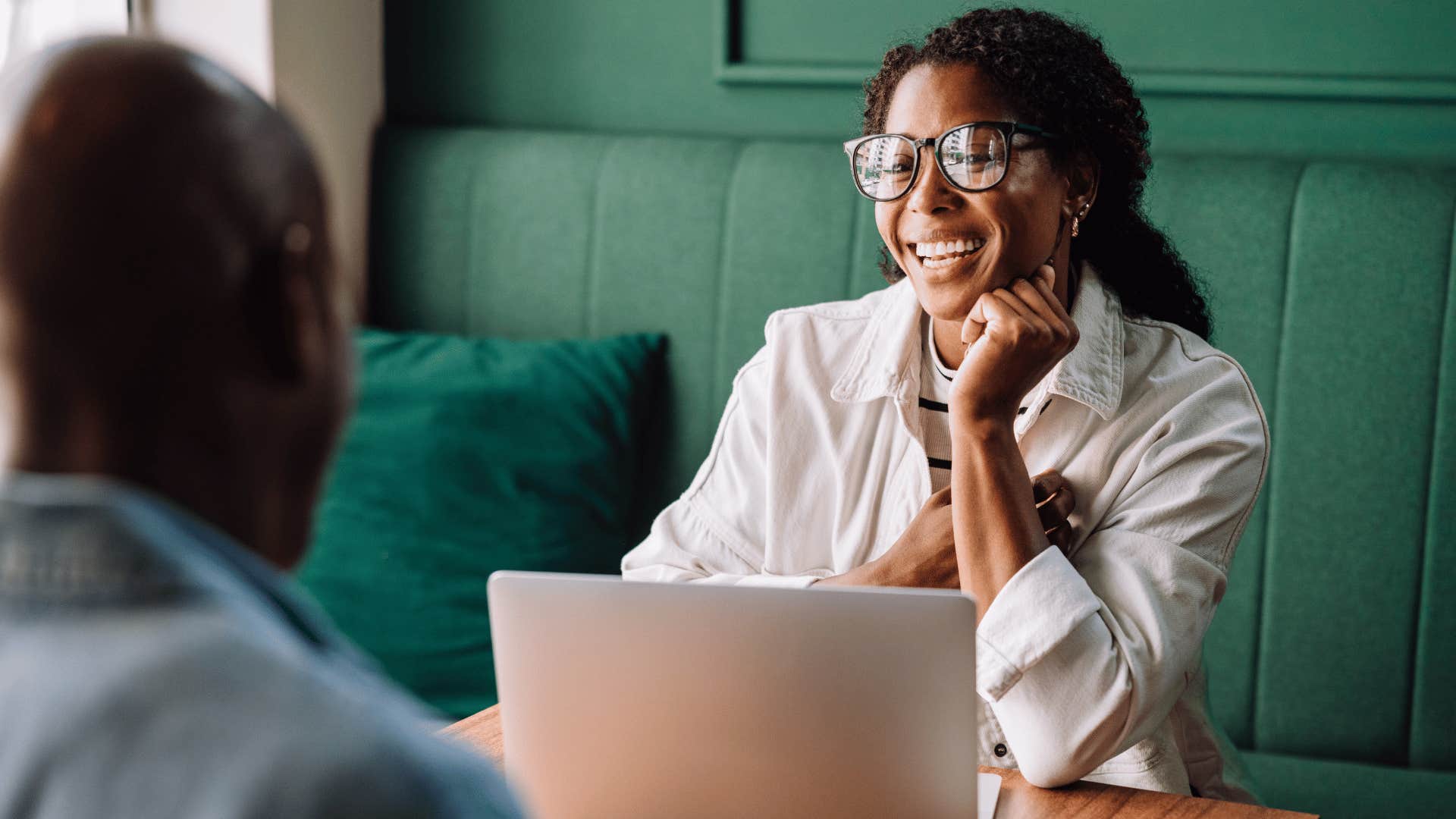 interested professional woman listening to man speak