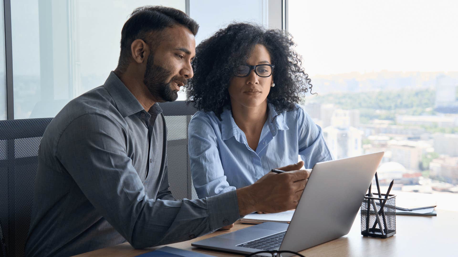 man figuring out other options with co-worker