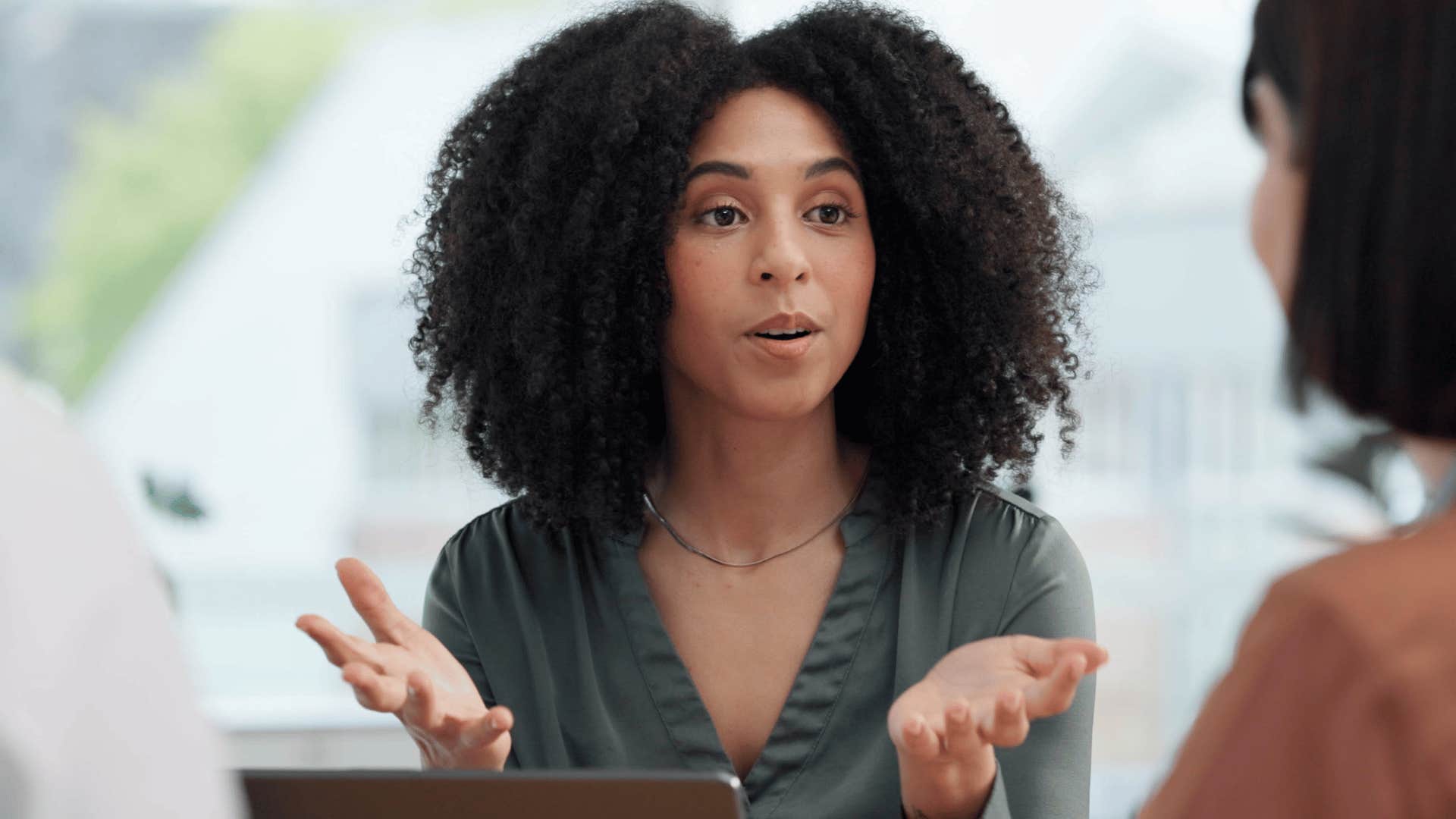 businesswoman asking for more information from colleague
