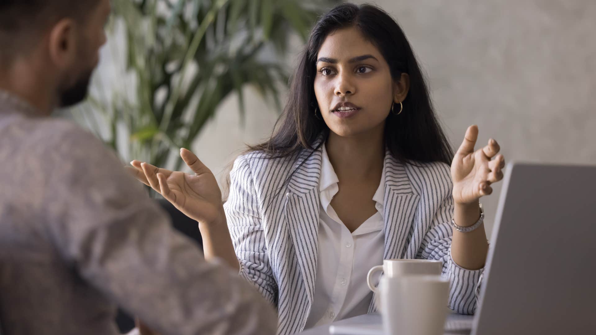 woman telling co-worker she isnt the right person for the job