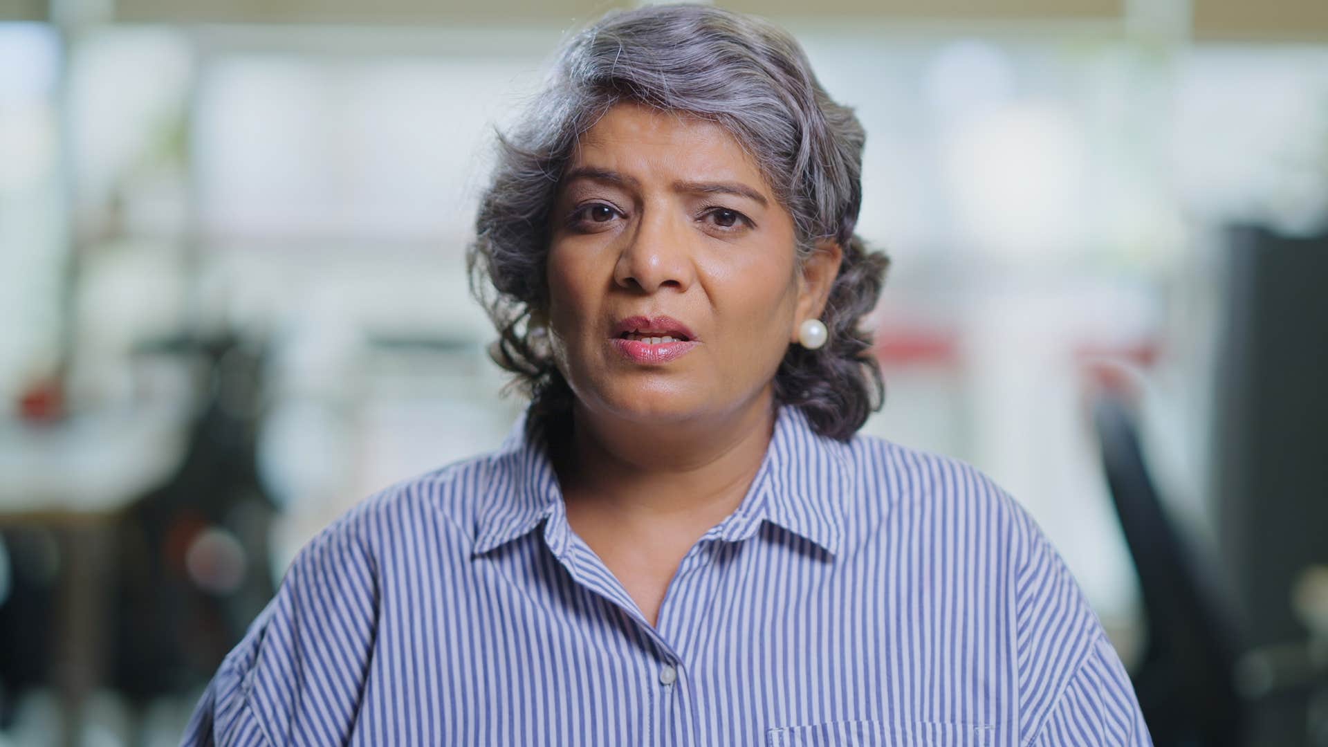 annoyed professional woman not working well with colleague