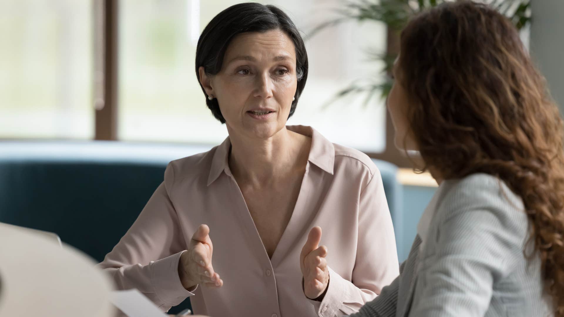 woman telling colleague shes not here to bond but to work