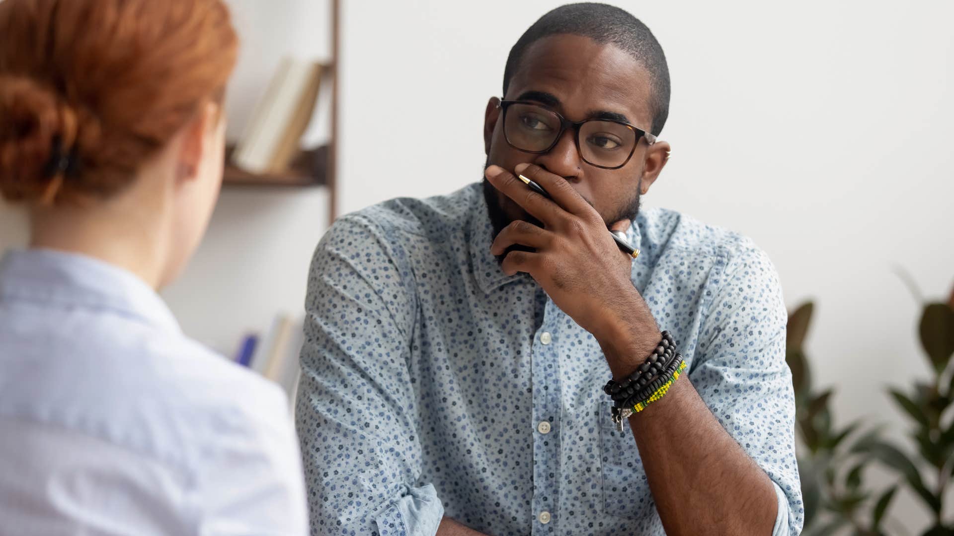 stressed man choosing peace over pettiness listening to peer