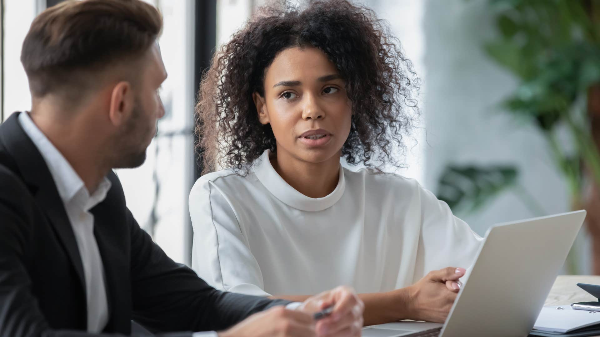 woman telling colleague shes remaining professional