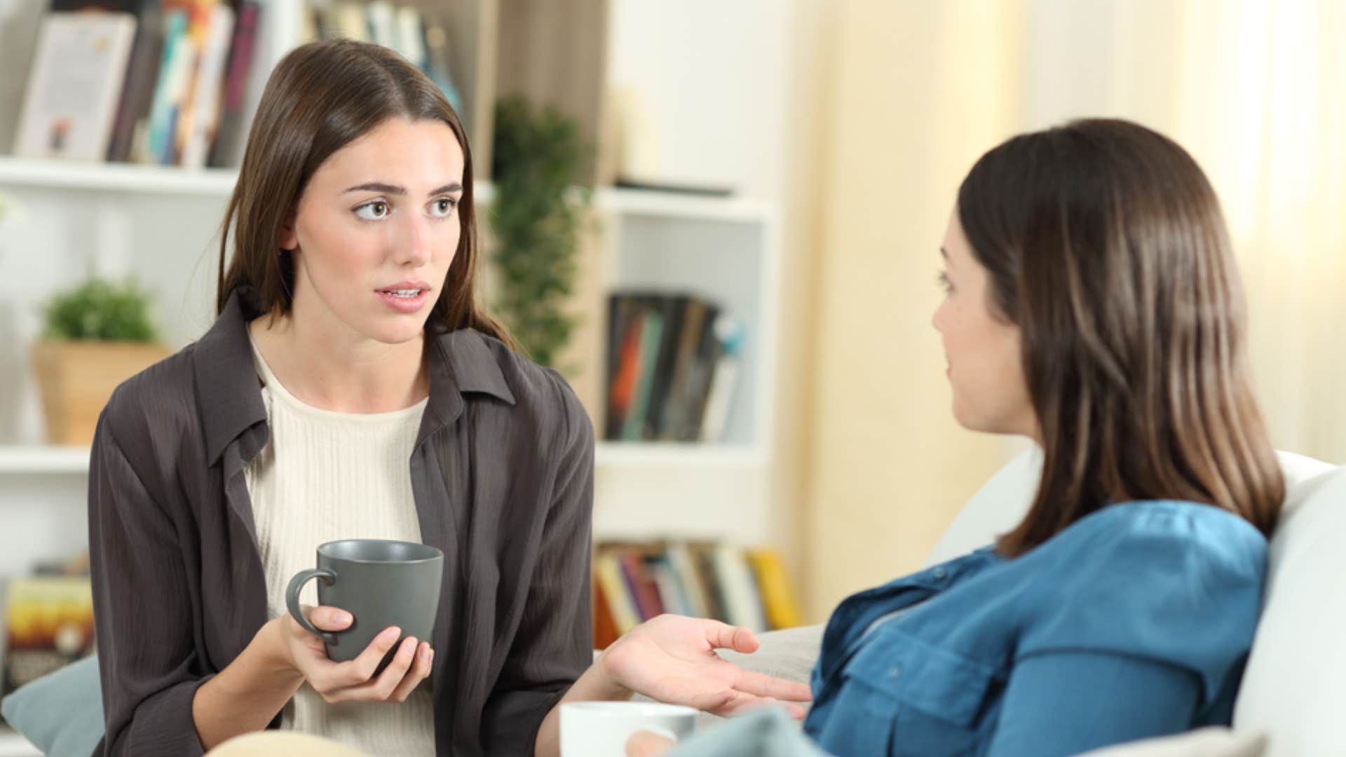 woman explaining to friend why she hesitated to make decision