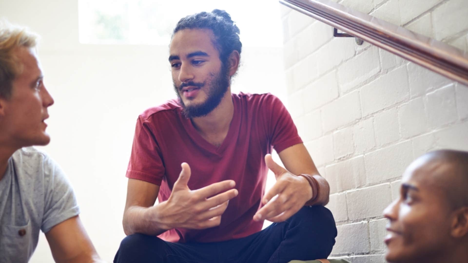 man telling friends they to learn from their experiences