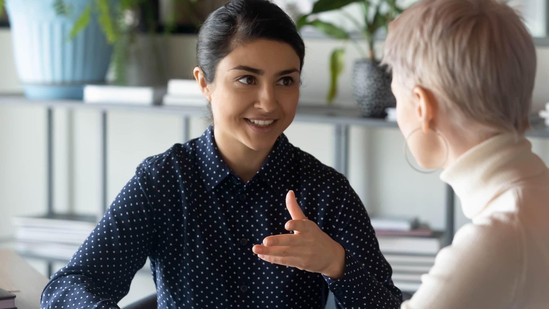 woman smiling saying she appreciates her co-workers perspective
