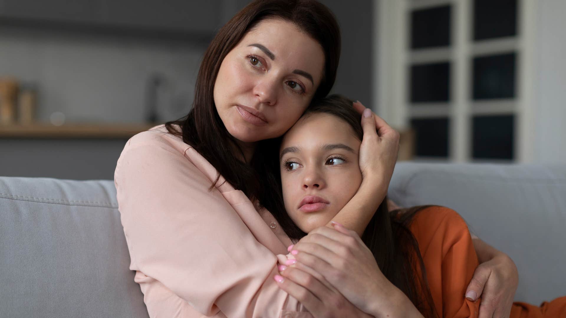 woman hugging her daughter saying she understands
