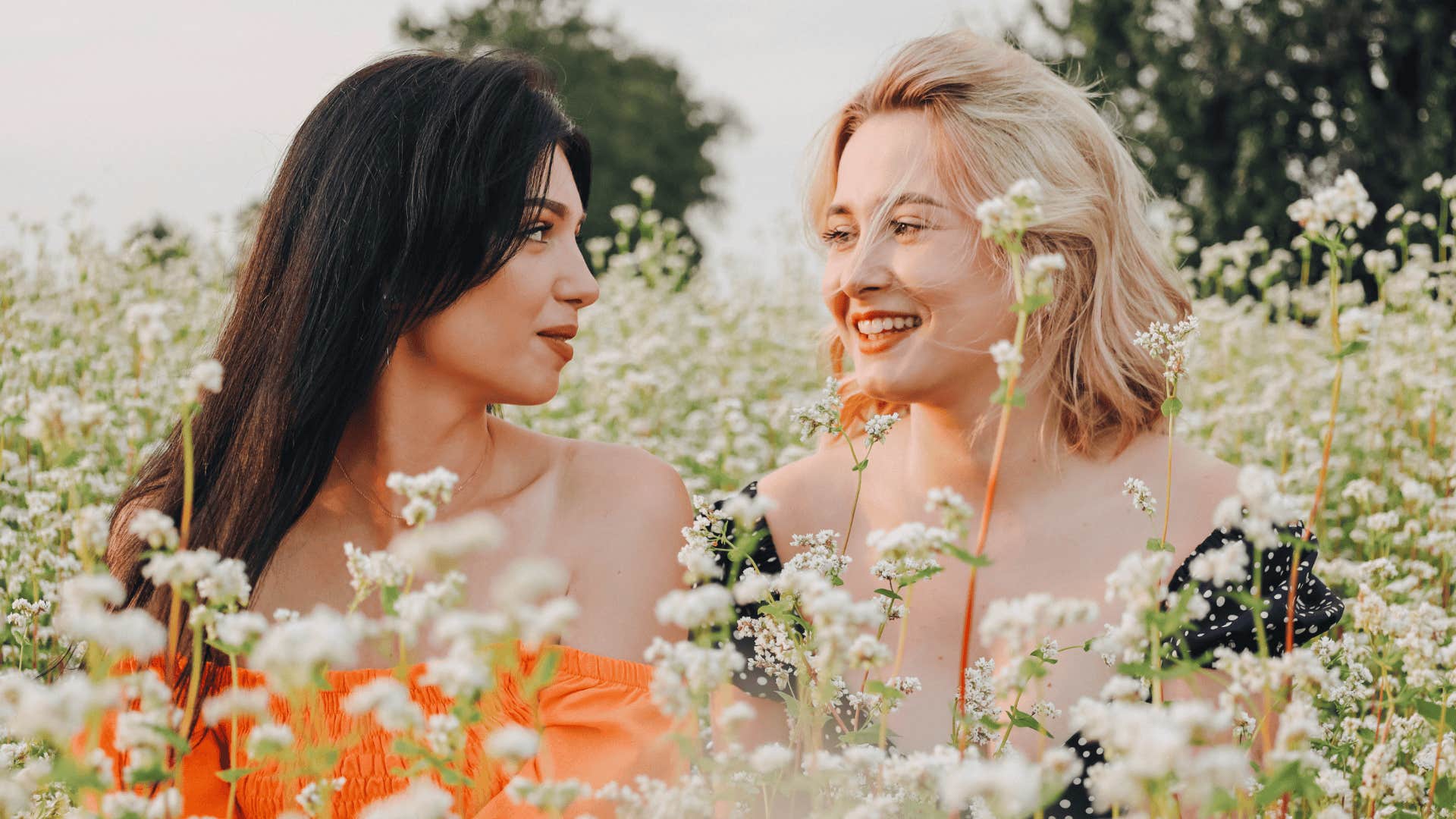 two women in a field of flowers that believe Patience brings peace