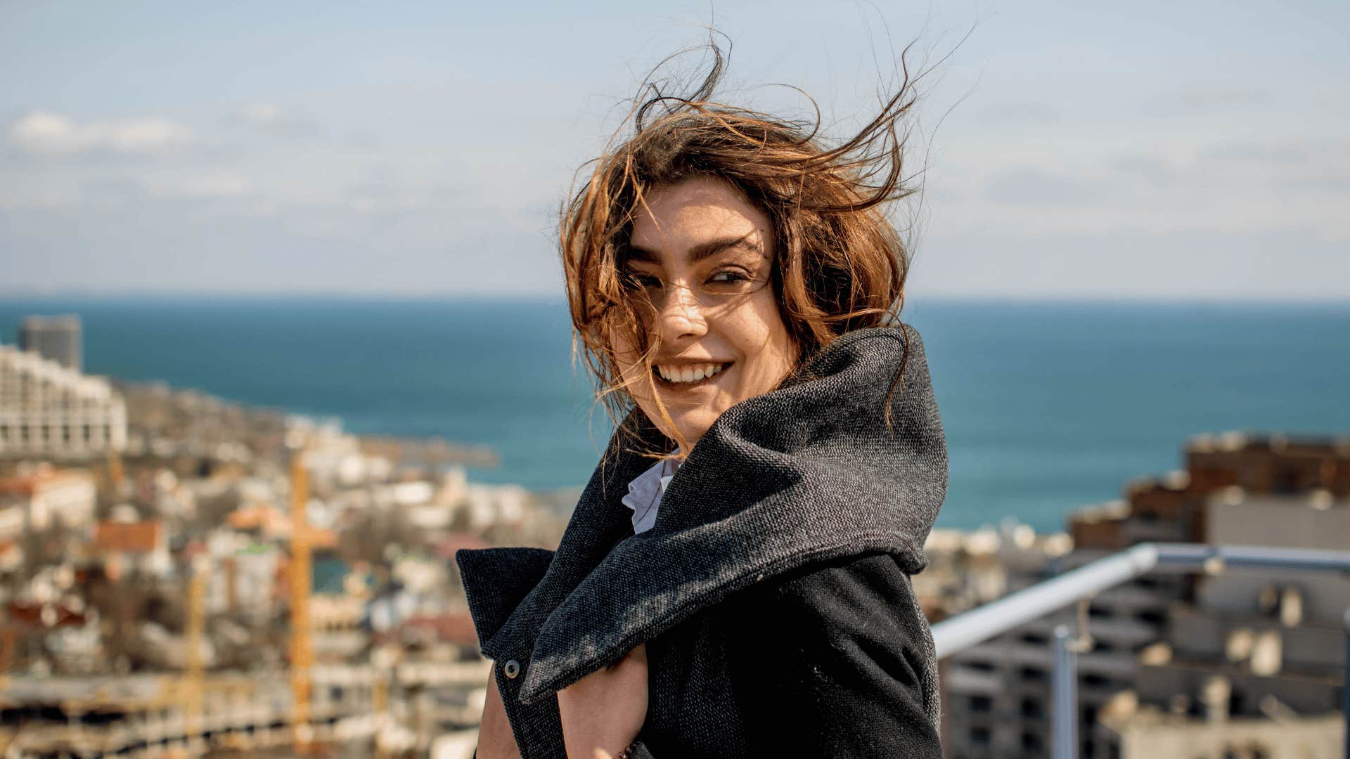 woman standing on a windy cliff seeking someone who appreciates her