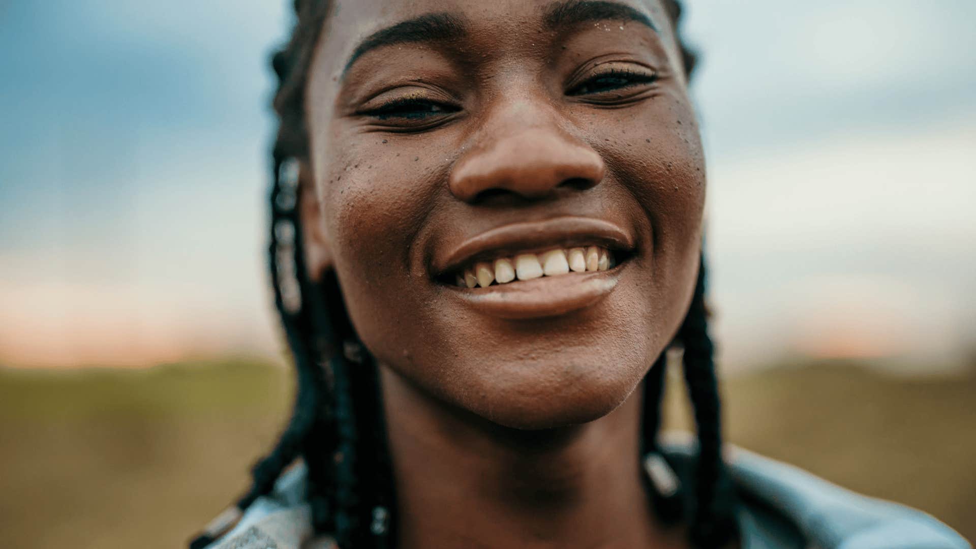  smiling woman won’t stay small for other people’s comfort