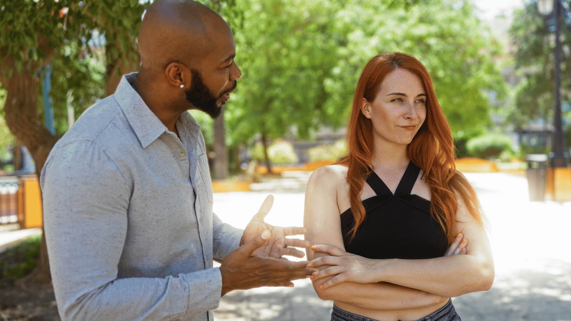 woman annoyed at man during argument for taking away her shine