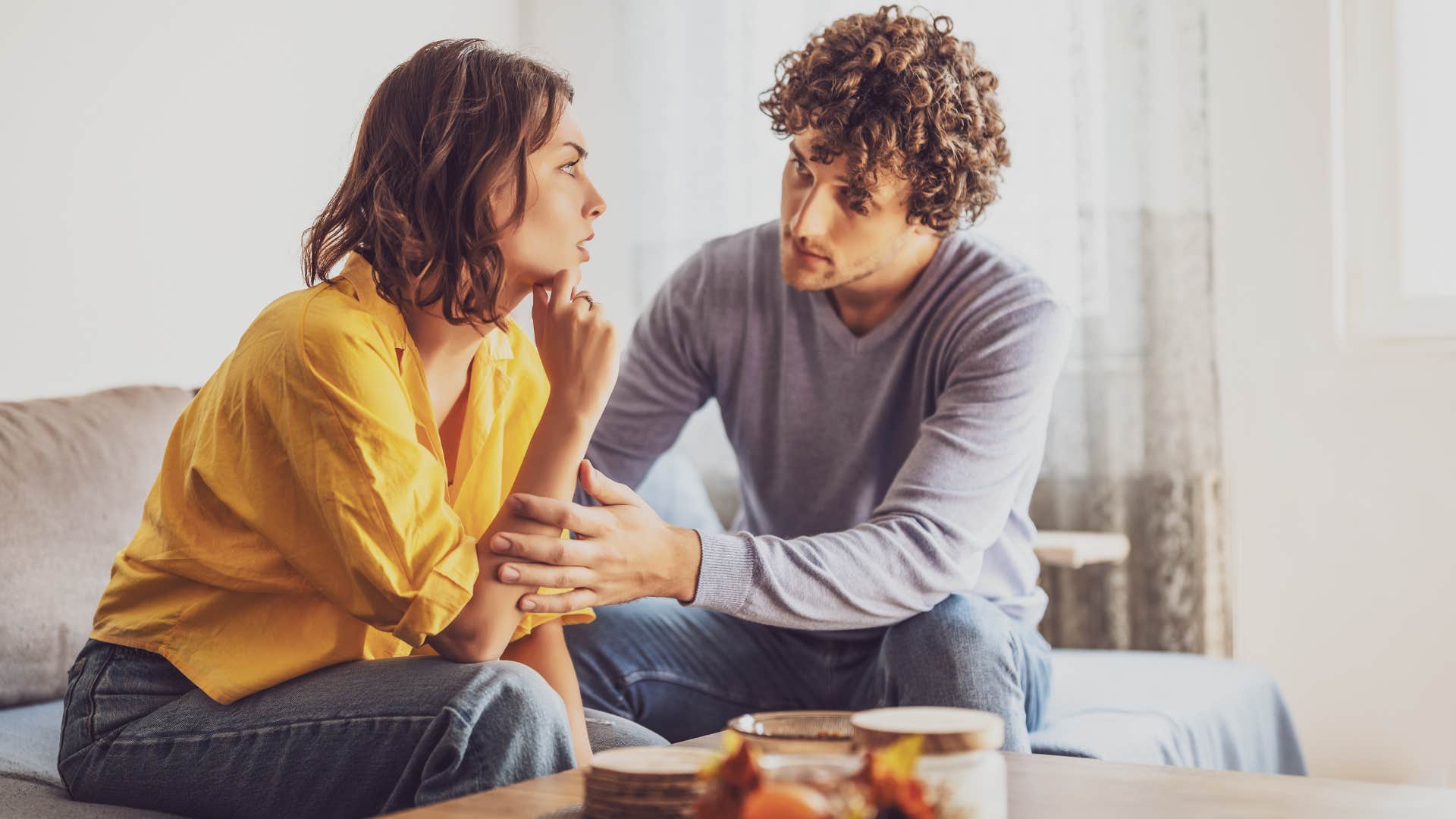 man asking how he can make his partners day better comforting her