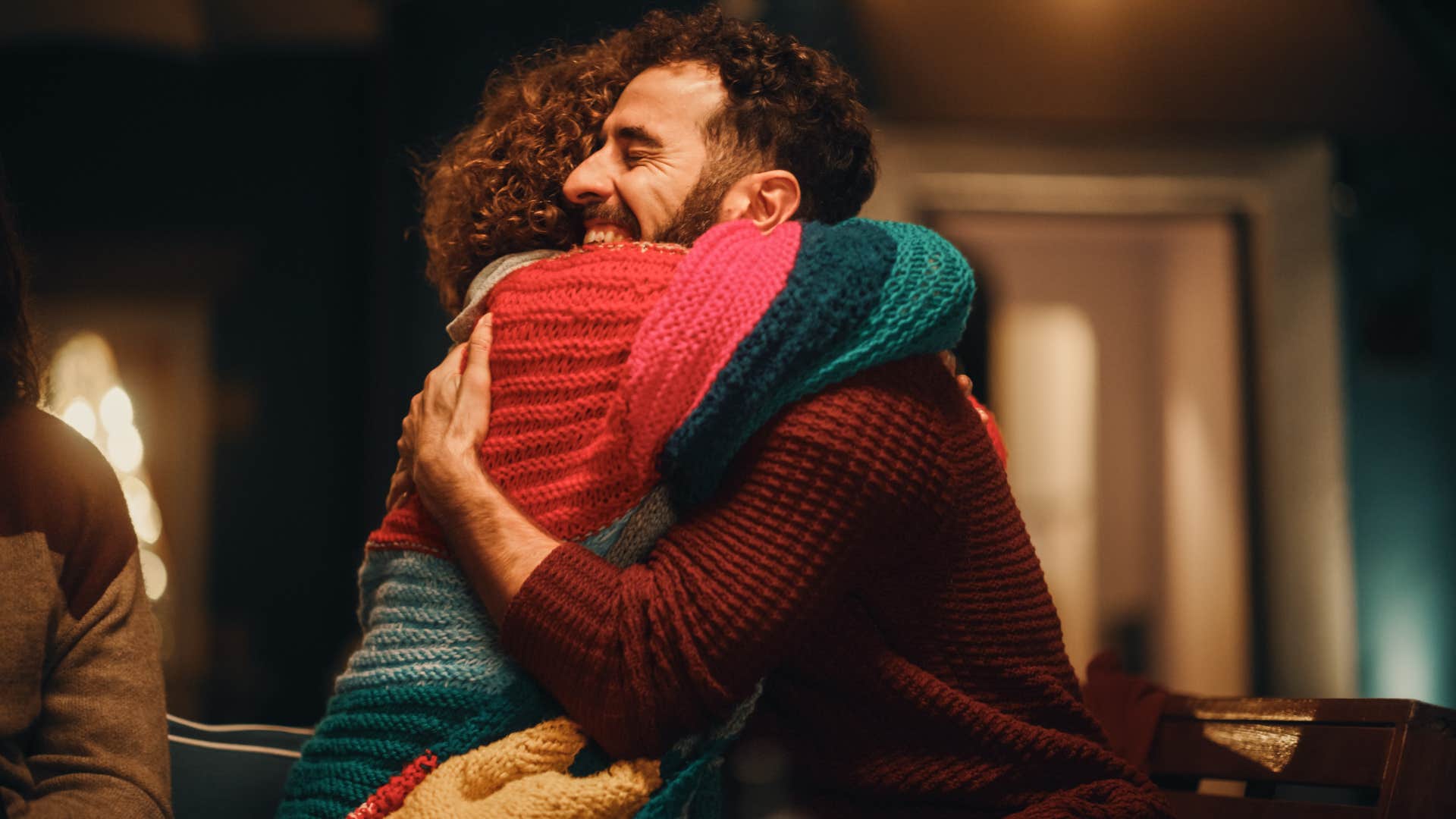 man hugging woman showing how proud he is of her