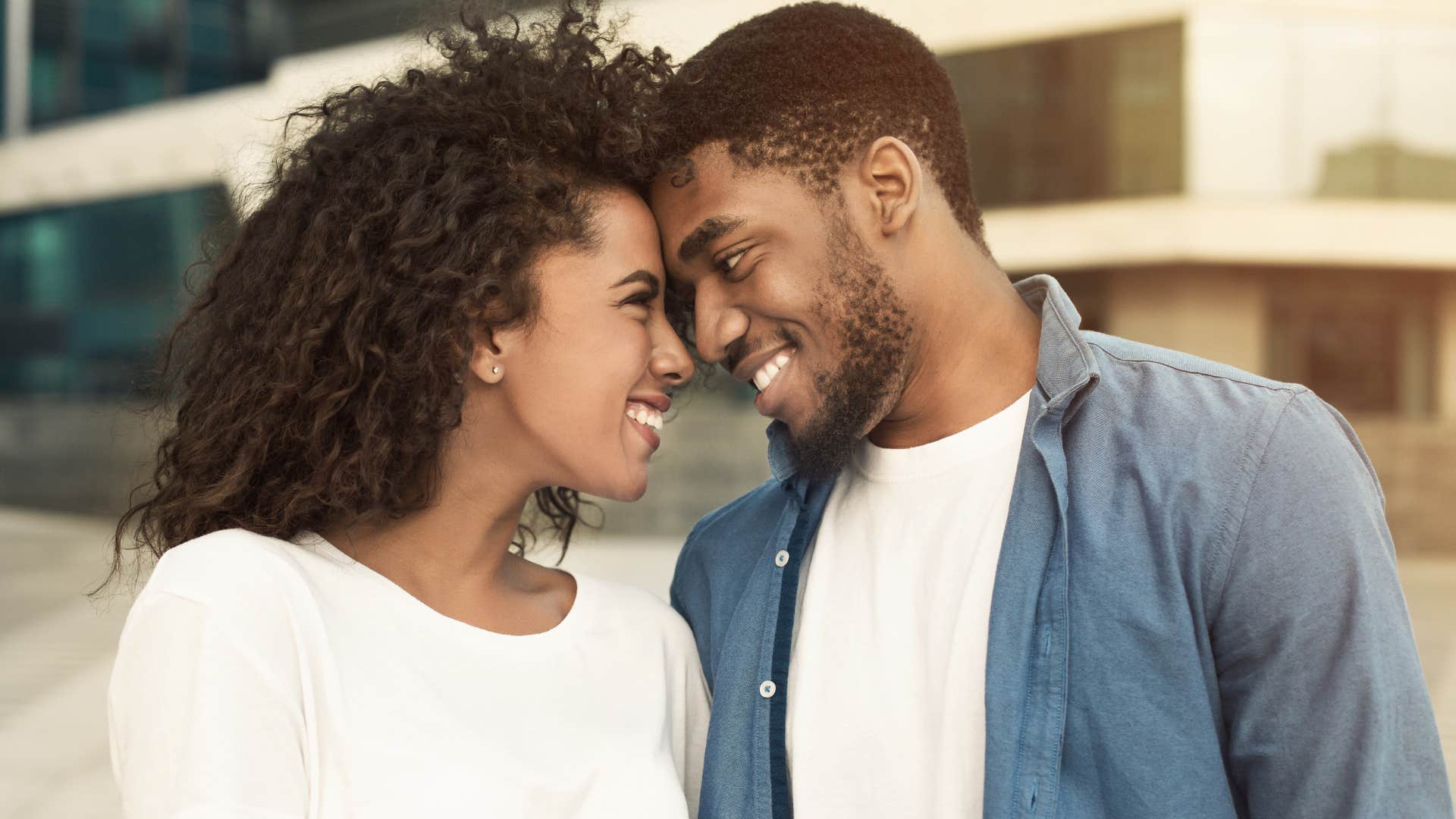 couple looking into each other's eyes smiling