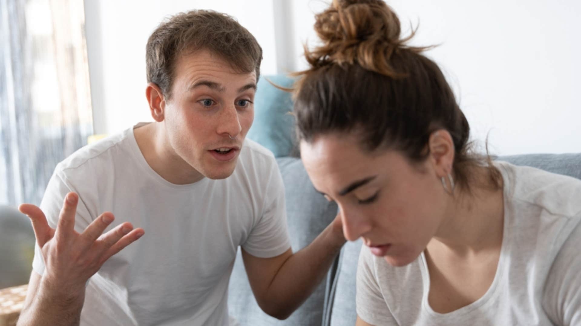 man scolding his girlfriend asking what she wants