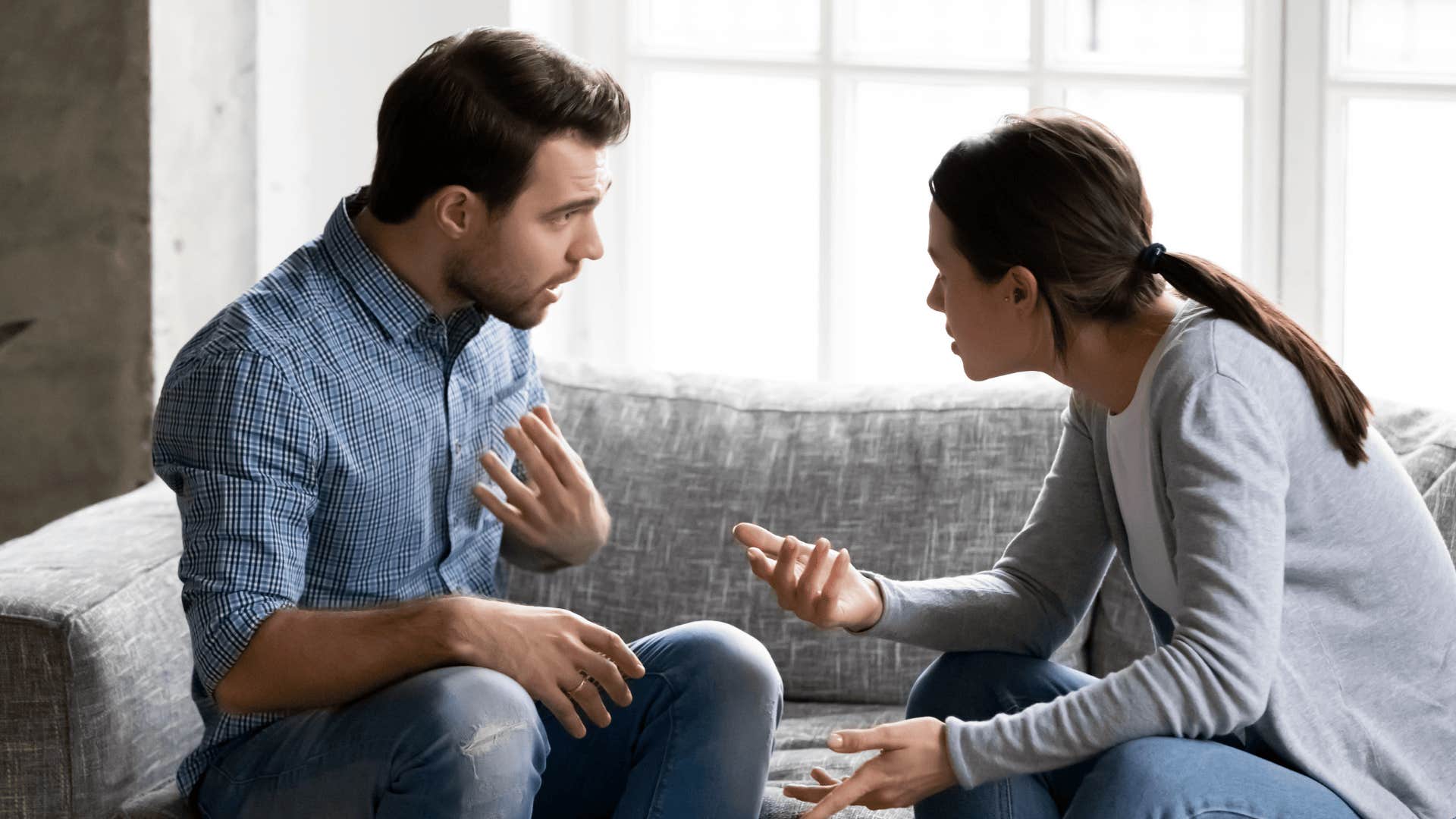 upset couple arguing using phrases that can wreck a good relationship