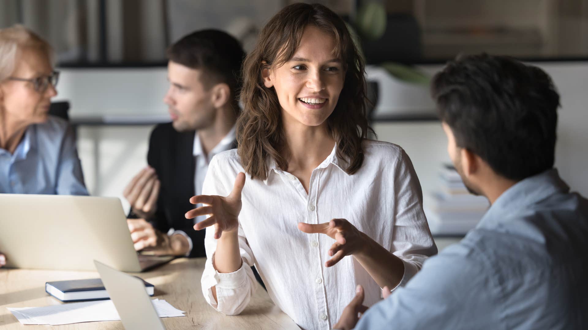 woman explaining the nuance of a situation to colleague