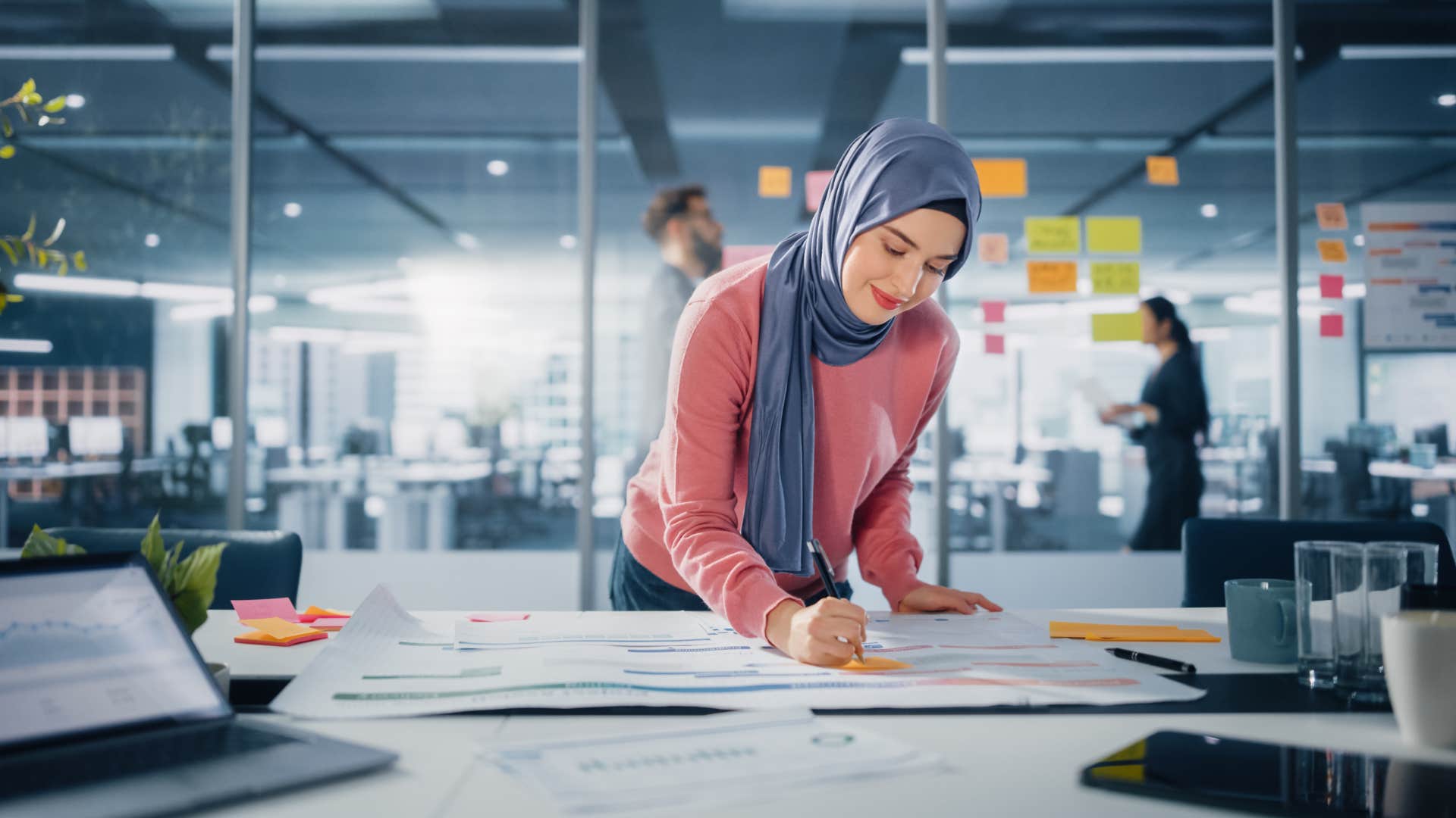 A young woman is just scratching the surface of her corporate job.
