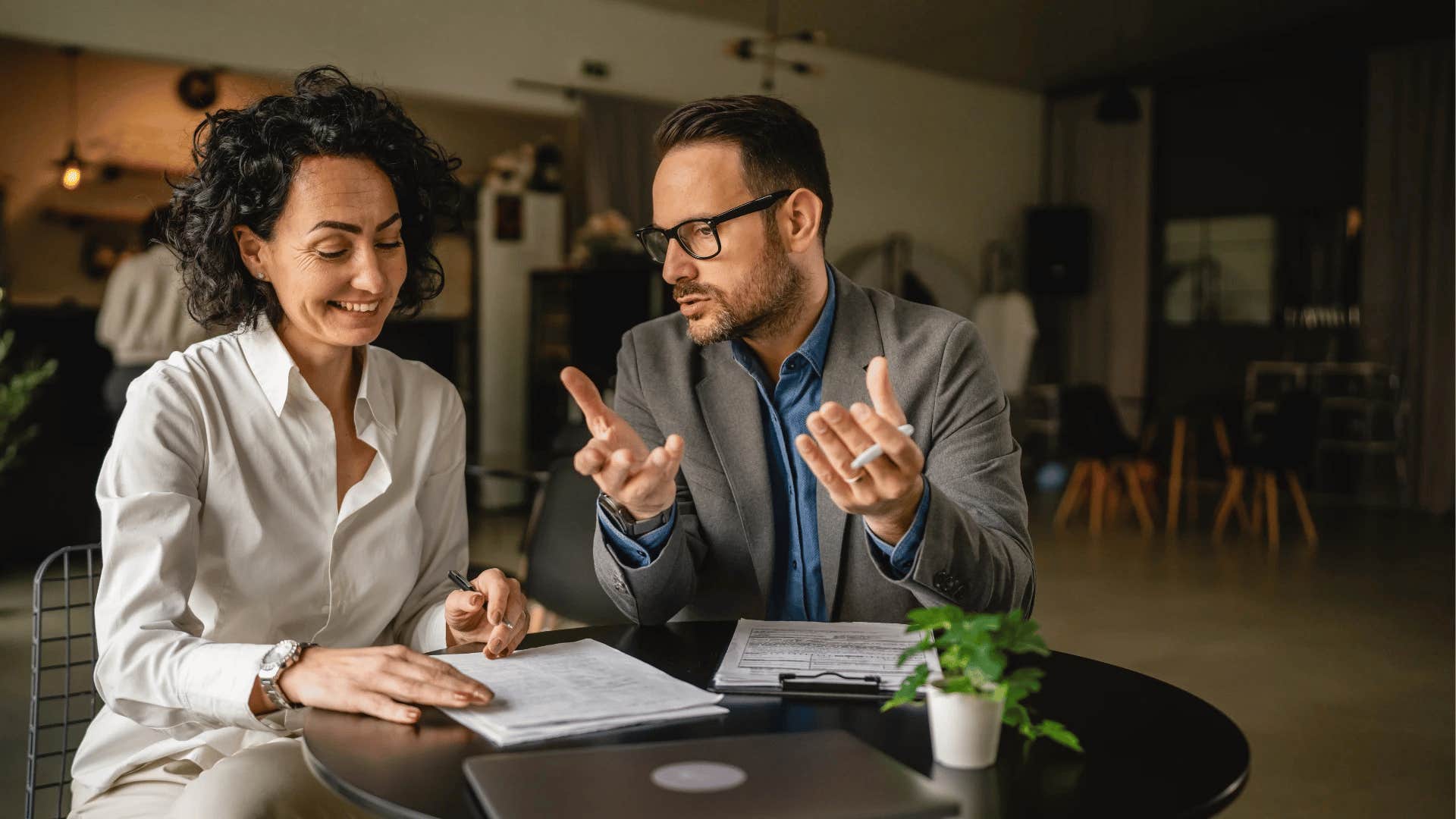 man explaining the fact of the matter to colleague